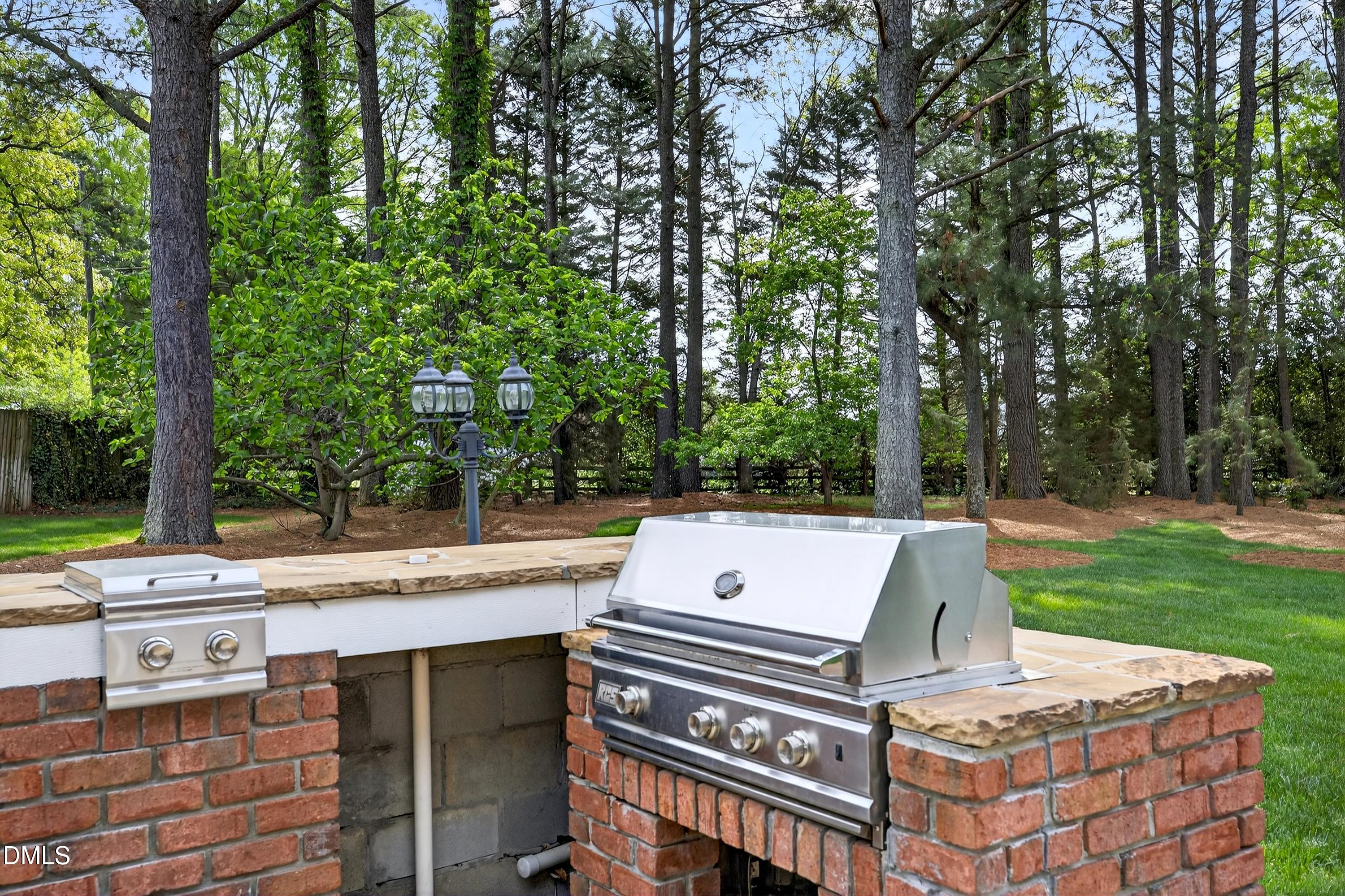 2217 Moss Point Lane Raleigh, NC 27606 - Photo 51 of 70 a view of a patio with a yard