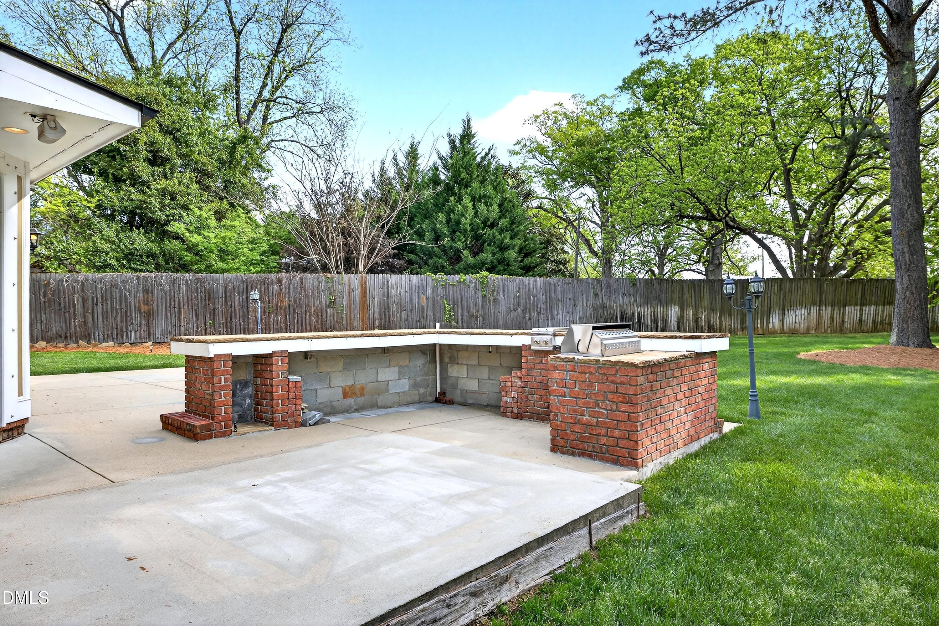2217 Moss Point Lane Raleigh, NC 27606 - Photo 52 of 70 a view of a swimming pool with a patio