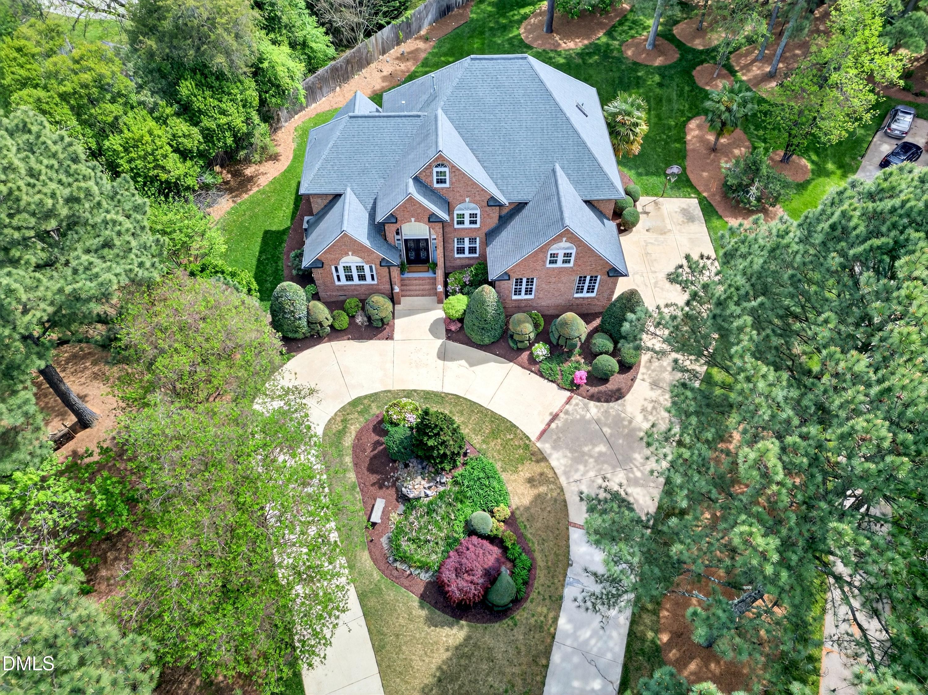 2217 Moss Point Lane Raleigh, NC 27606 - Photo 61 of 70 an aerial view of a house with a yard and a large tree