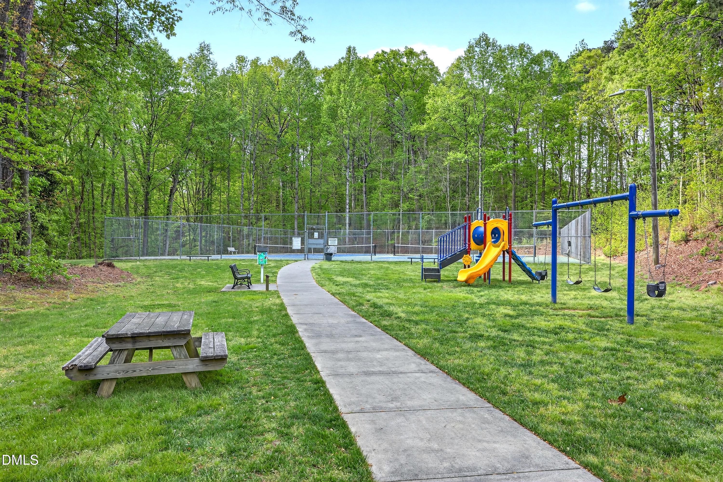 2217 Moss Point Lane Raleigh, NC 27606 - Photo 66 of 70 a view of a backyard with a slide