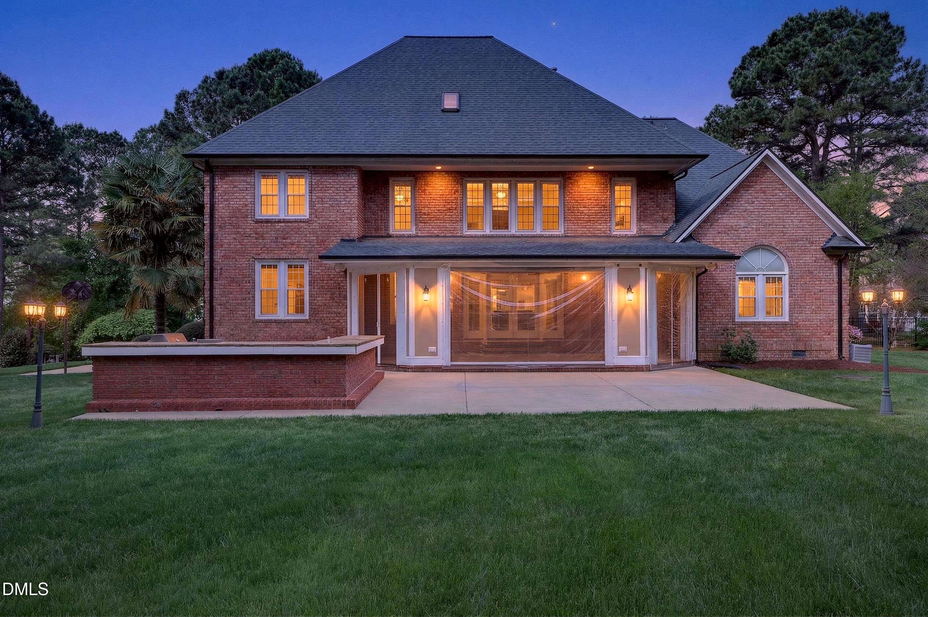 2217 Moss Point Lane Raleigh, NC 27606 - Photo 68 of 70 a front view of a house with a yard