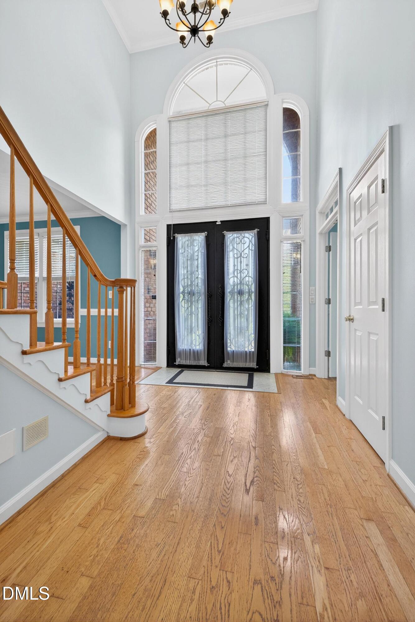 2217 Moss Point Lane Raleigh, NC 27606 - Photo 6 of 70 a view of an entryway with a fireplace