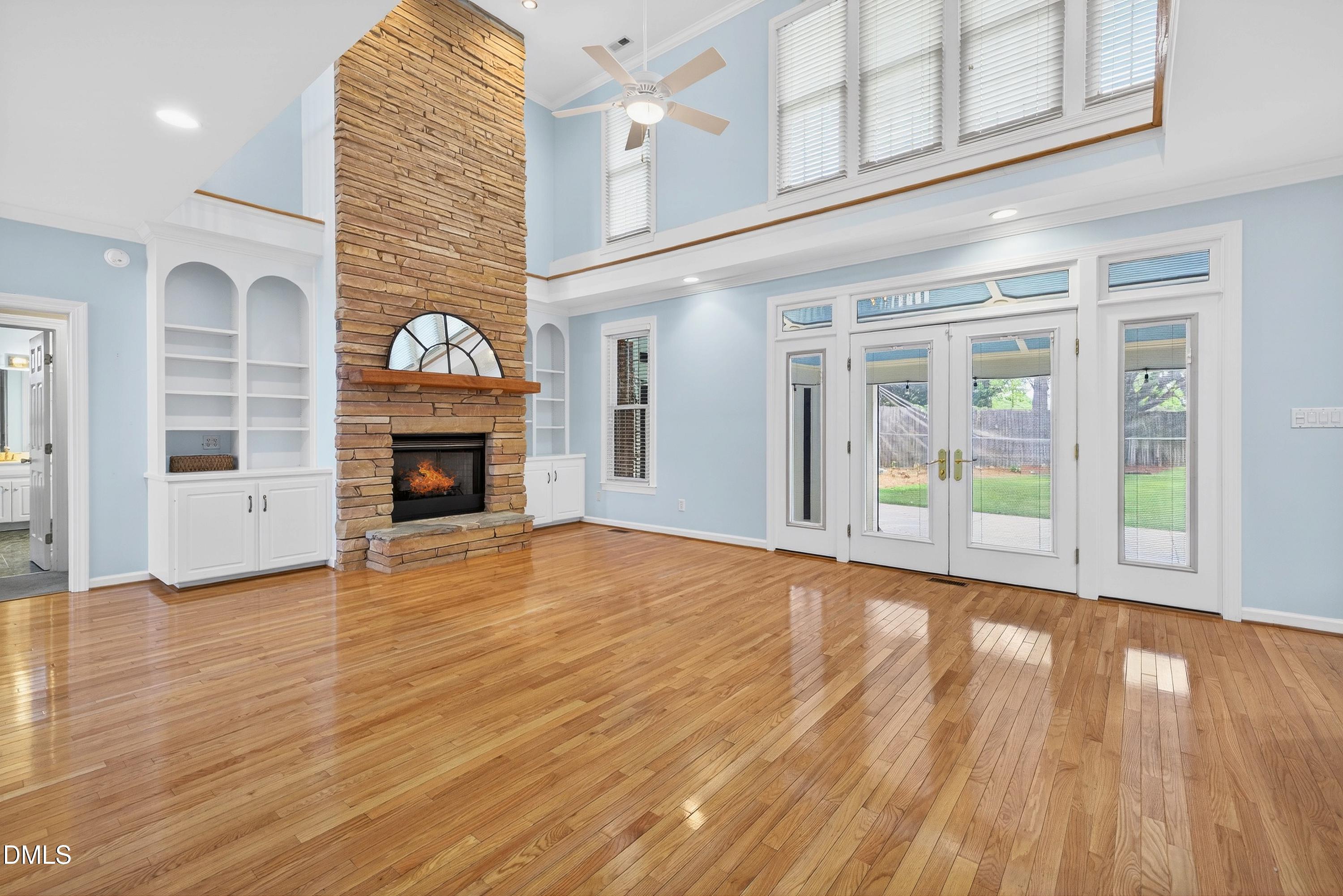 2217 Moss Point Lane Raleigh, NC 27606 - Photo 8 of 70 a view of an empty room with wooden floor and a window
