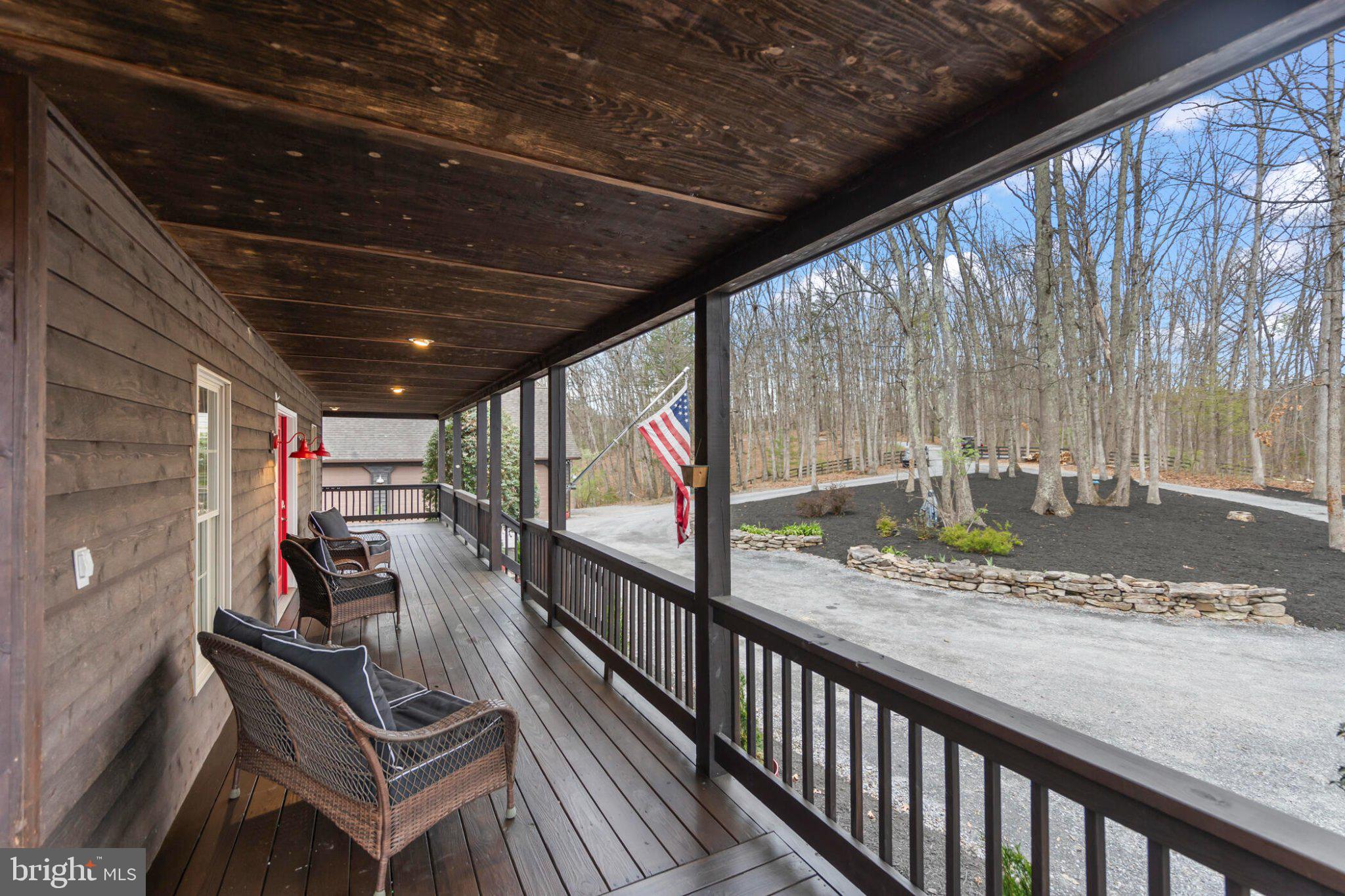 448 Adams Road Winchester, VA 22603 - Photo 2 of 96 Charming porch with serene woodland views.
