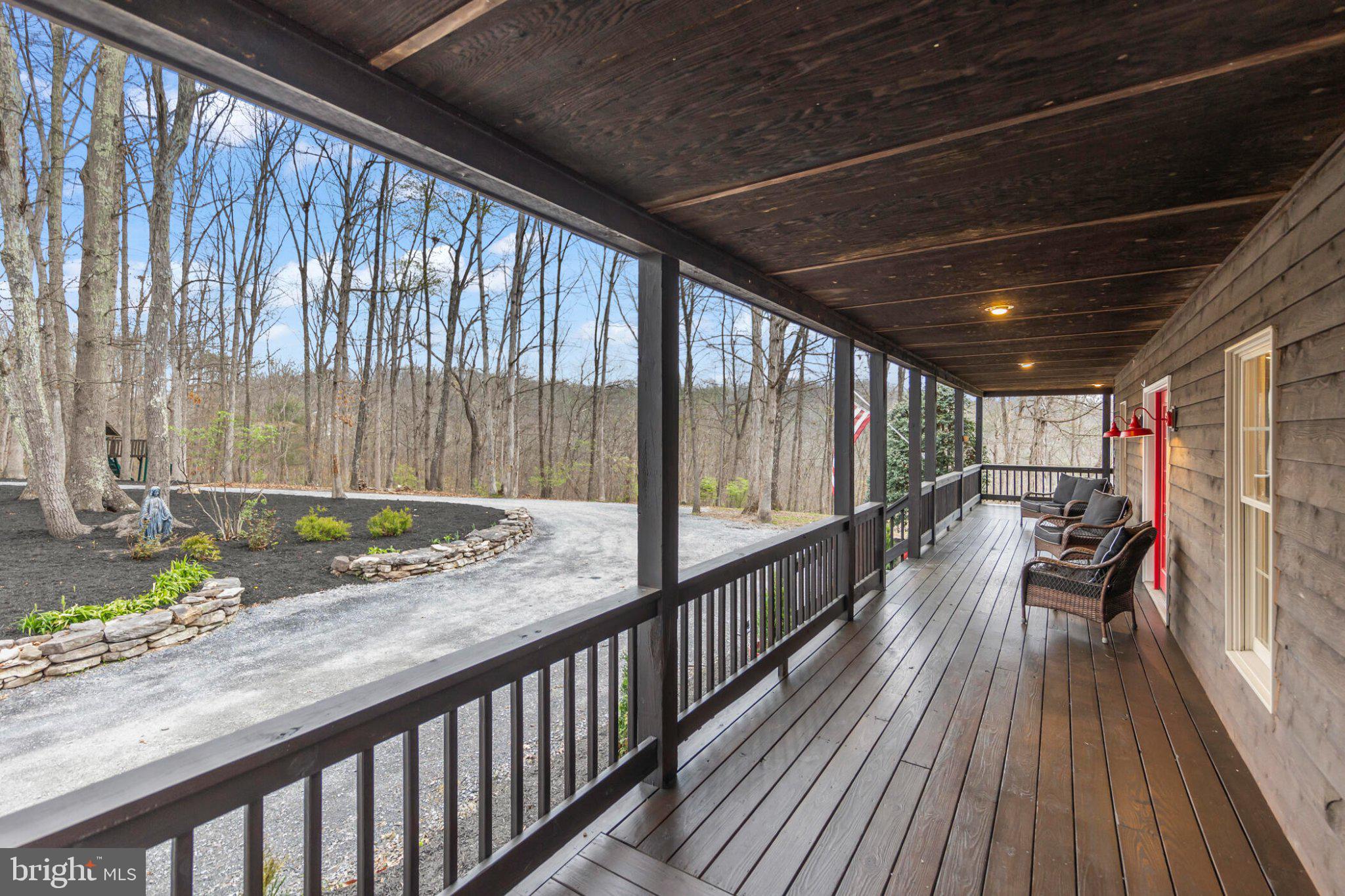 448 Adams Road Winchester, VA 22603 - Photo 3 of 96 Serene porch with nature's embrace.