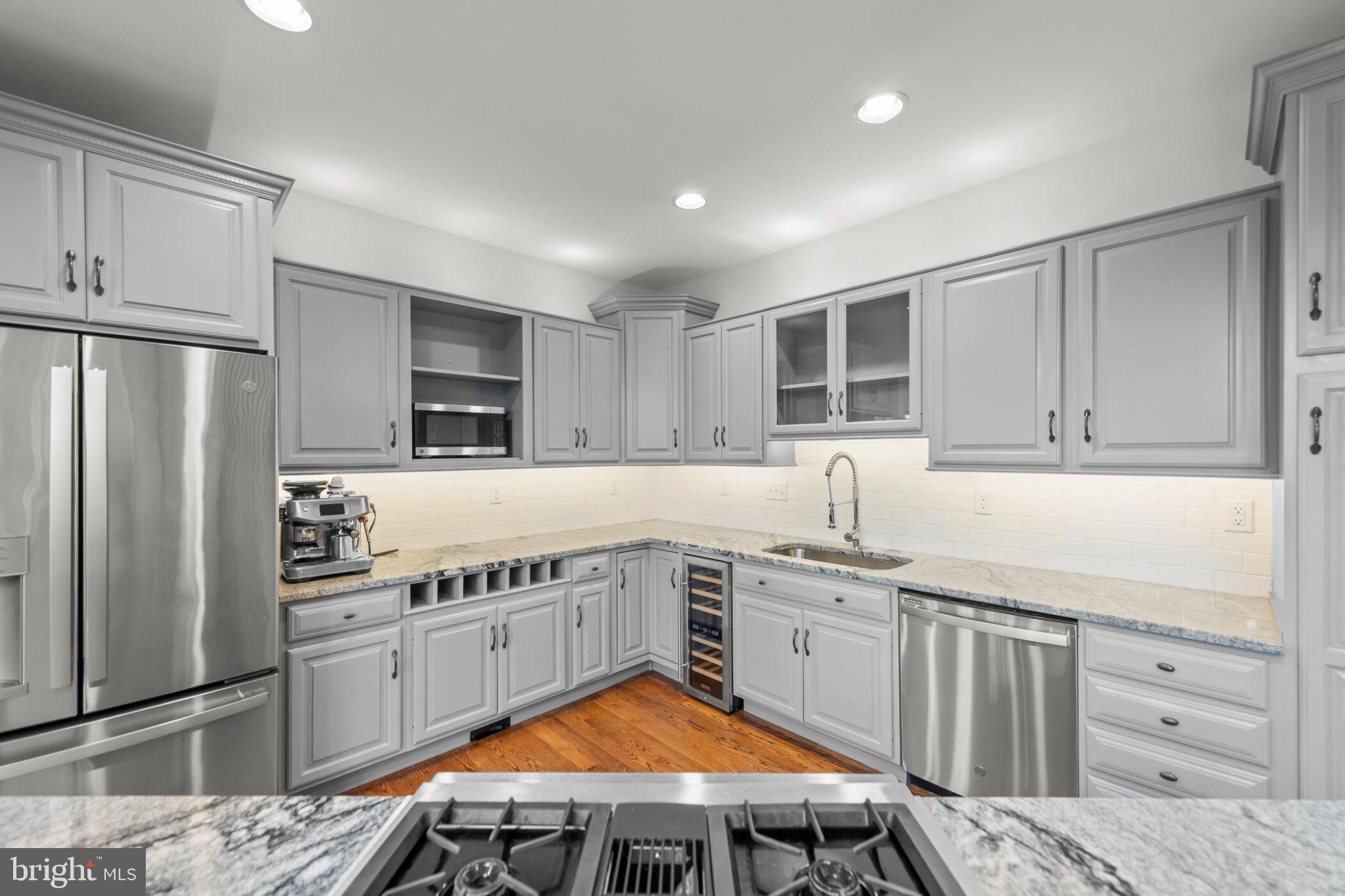 448 Adams Road Winchester, VA 22603 - Photo 9 of 96 Sleek modern kitchen with elegant finishes.