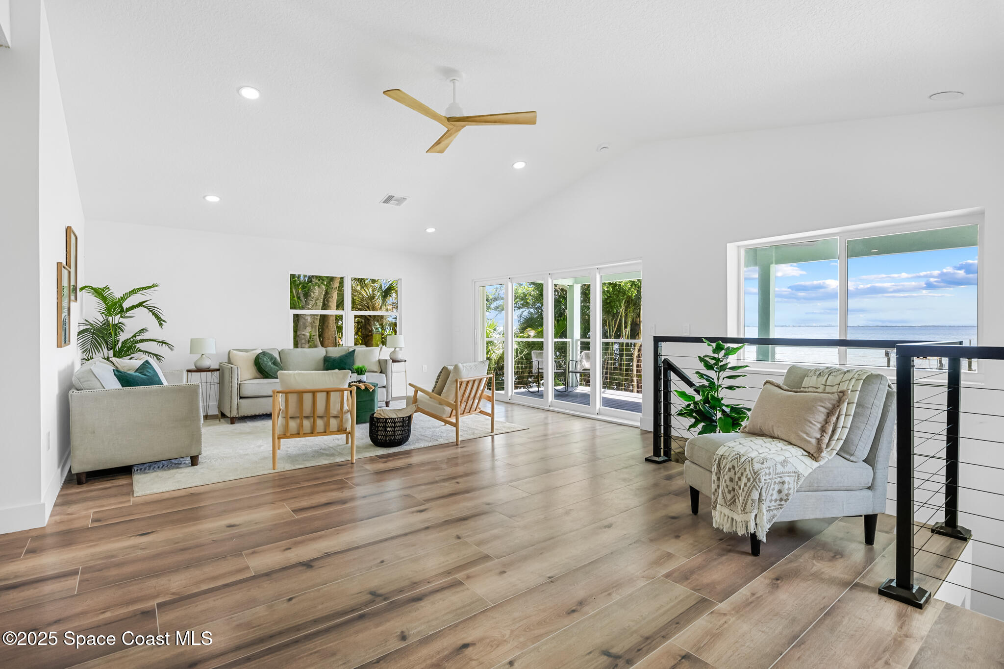 1313 Worth Court Northeast Palm Bay, FL 32905 - Photo 17 of 77 a living room with furniture and a large window