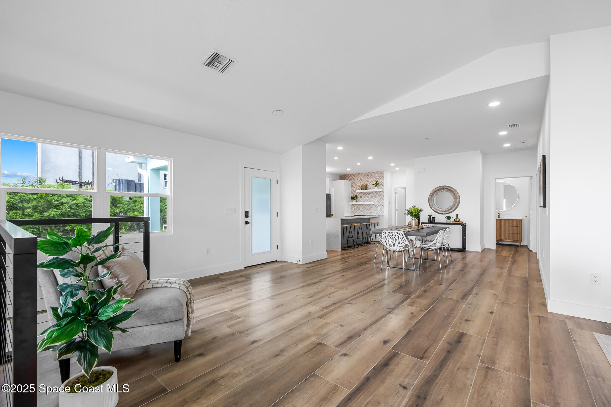 1313 Worth Court Northeast Palm Bay, FL 32905 - Photo 19 of 77 a living room with furniture and a wooden floor