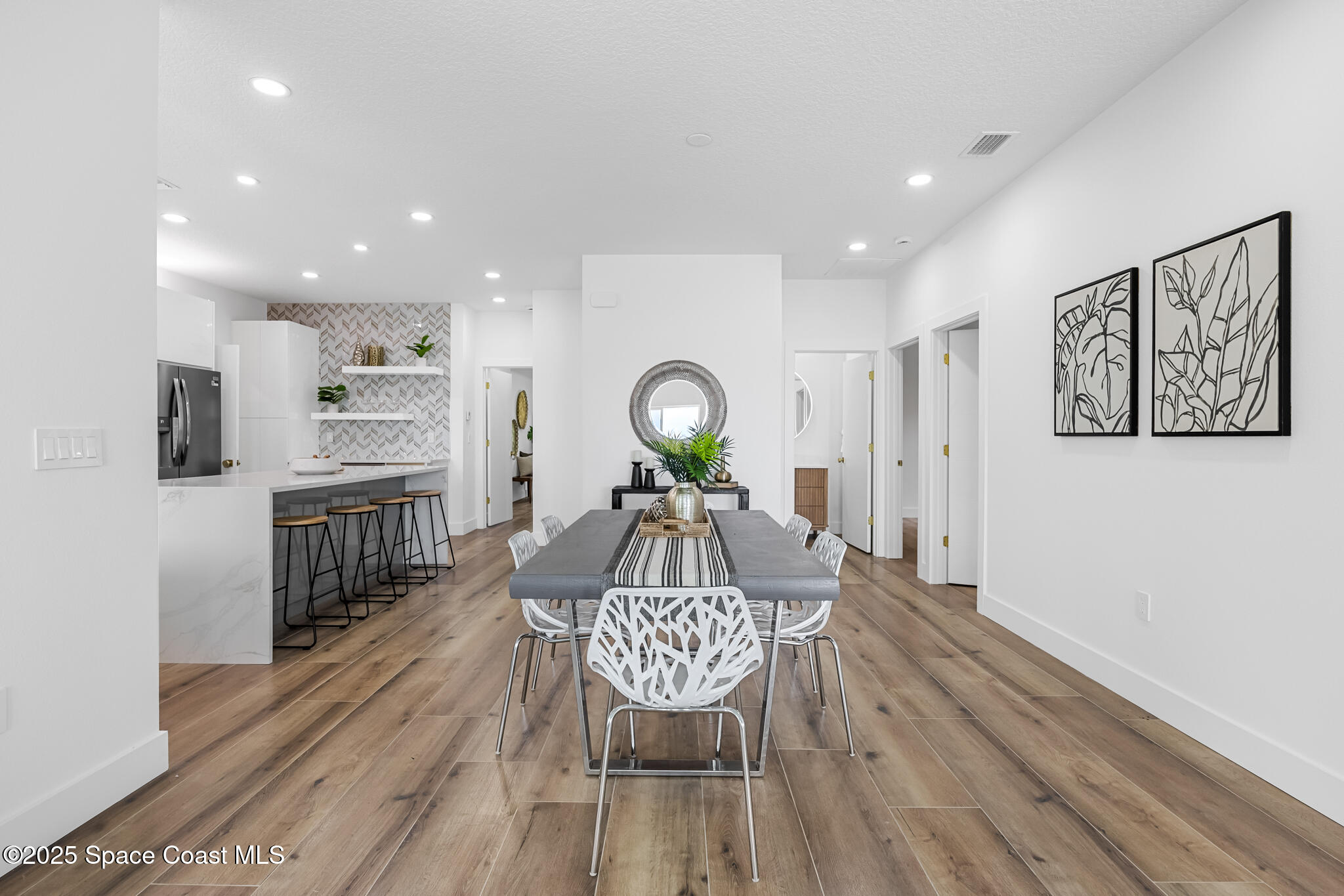 1313 Worth Court Northeast Palm Bay, FL 32905 - Photo 20 of 77 a living room with furniture and a wooden floor