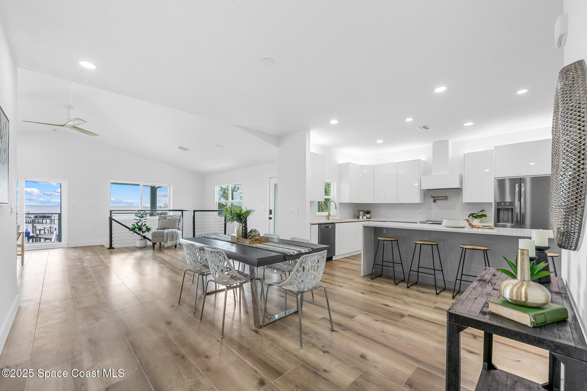 1313 Worth Court Northeast Palm Bay, FL 32905 - Photo 21 of 77 a kitchen with a table and chairs in it