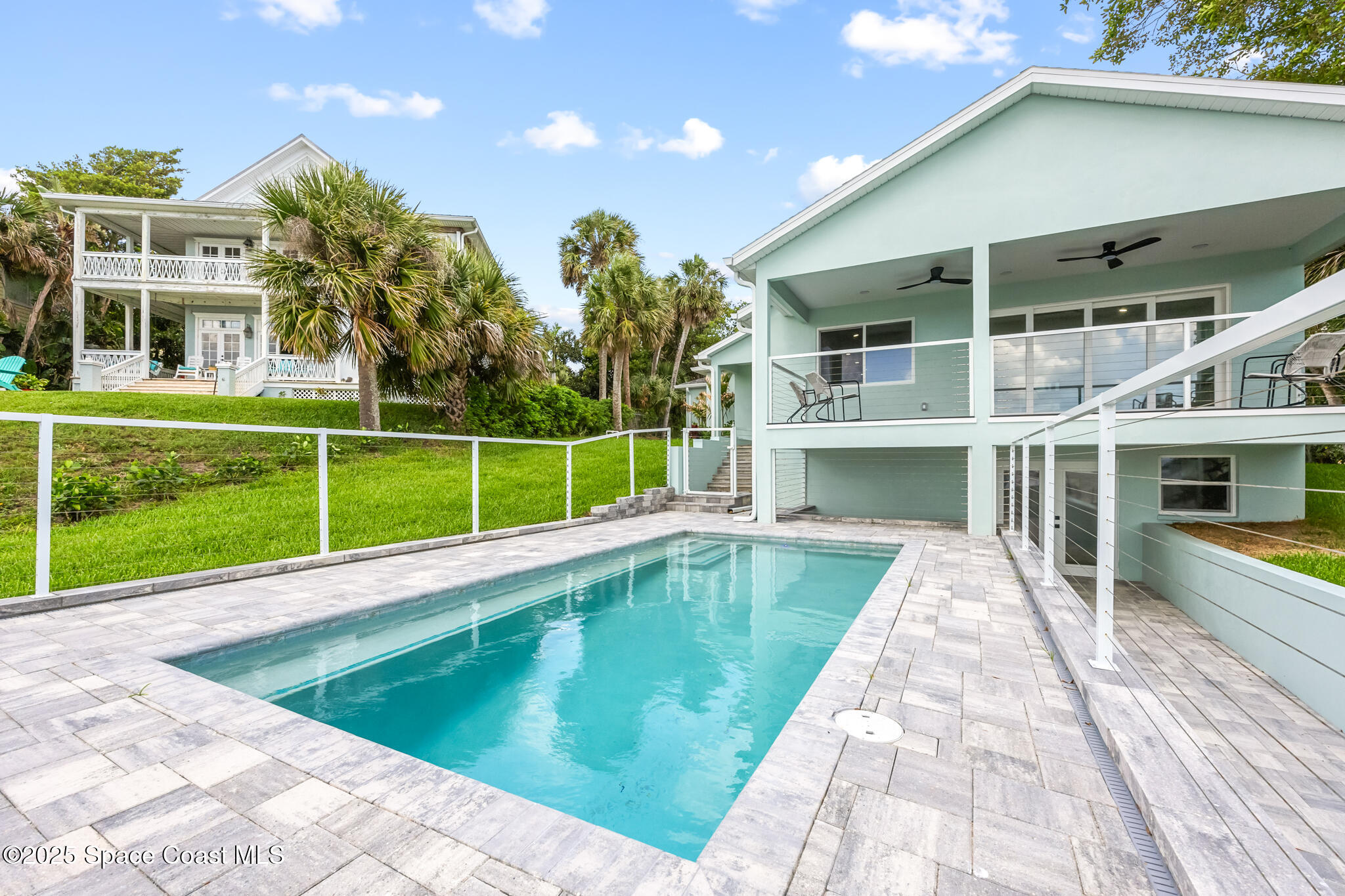 1313 Worth Court Northeast Palm Bay, FL 32905 - Photo 27 of 77 a view of a house with a swimming pool