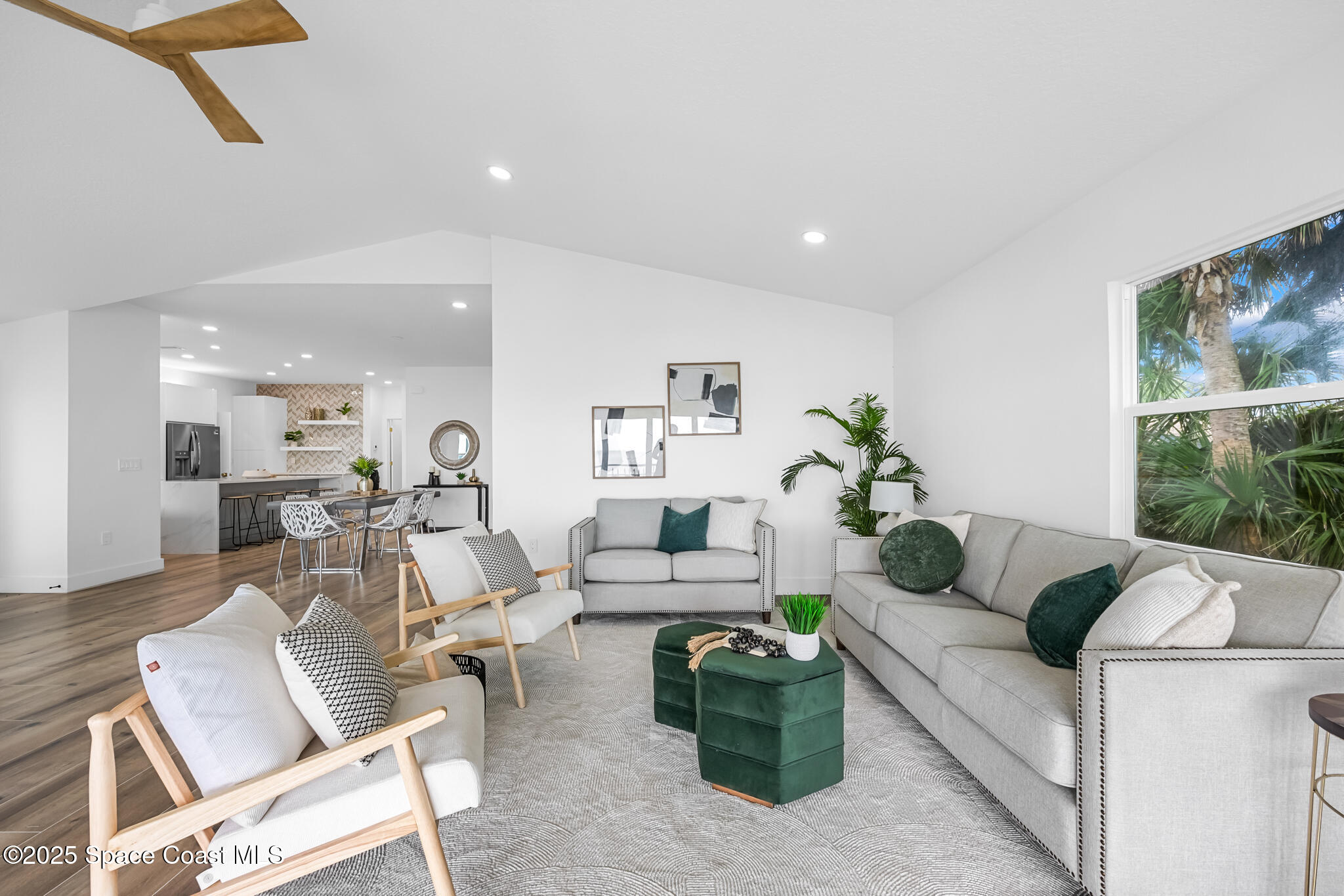 1313 Worth Court Northeast Palm Bay, FL 32905 - Photo 31 of 77 a living room with furniture and a large window