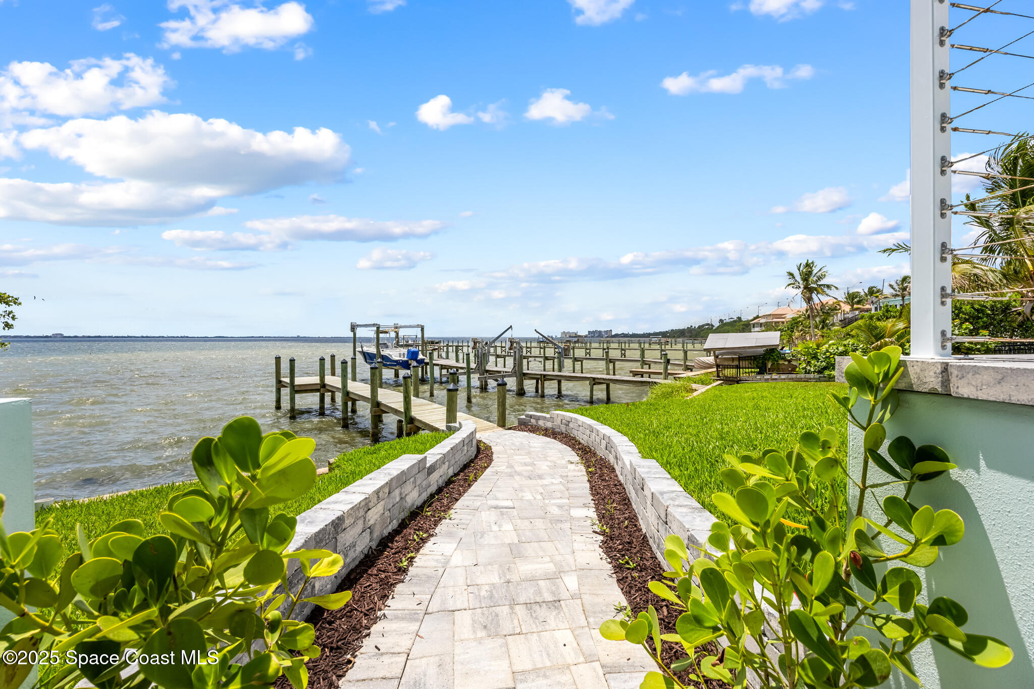 1313 Worth Court Northeast Palm Bay, FL 32905 - Photo 4 of 77 Pavered Sidewalk to Dock