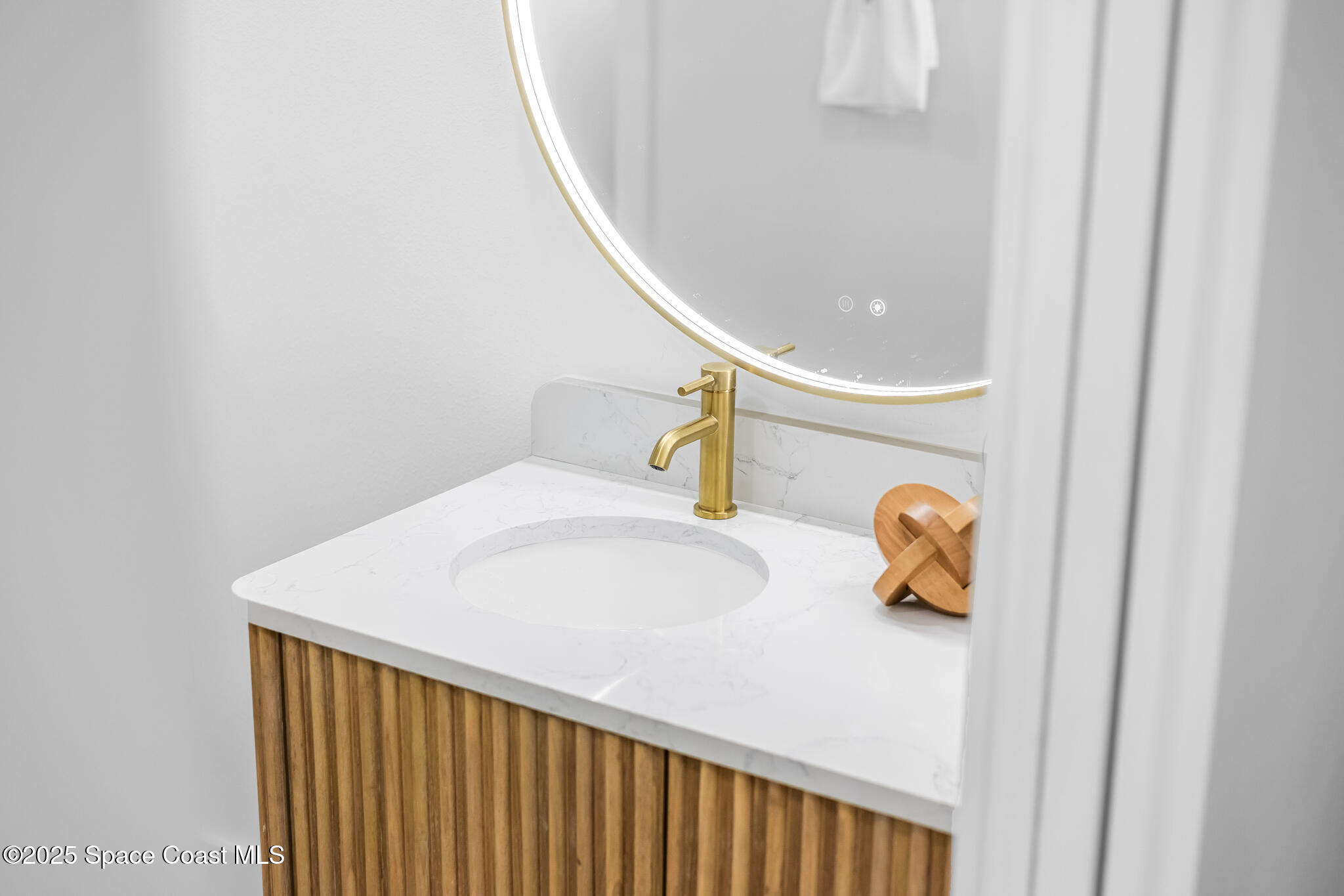 1313 Worth Court Northeast Palm Bay, FL 32905 - Photo 48 of 77 a bathroom with a sink and toilet