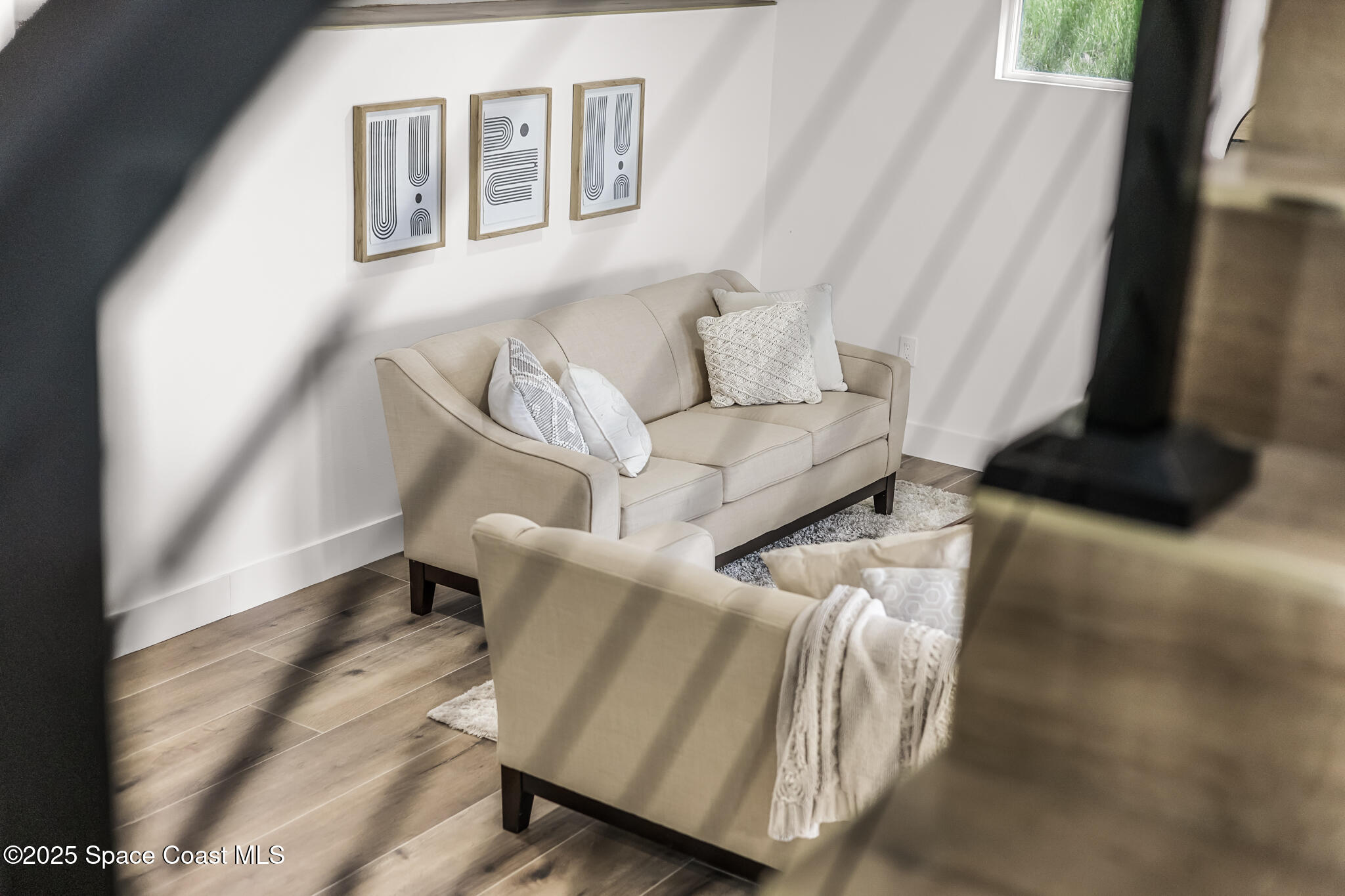 1313 Worth Court Northeast Palm Bay, FL 32905 - Photo 51 of 77 a living room with furniture and a window