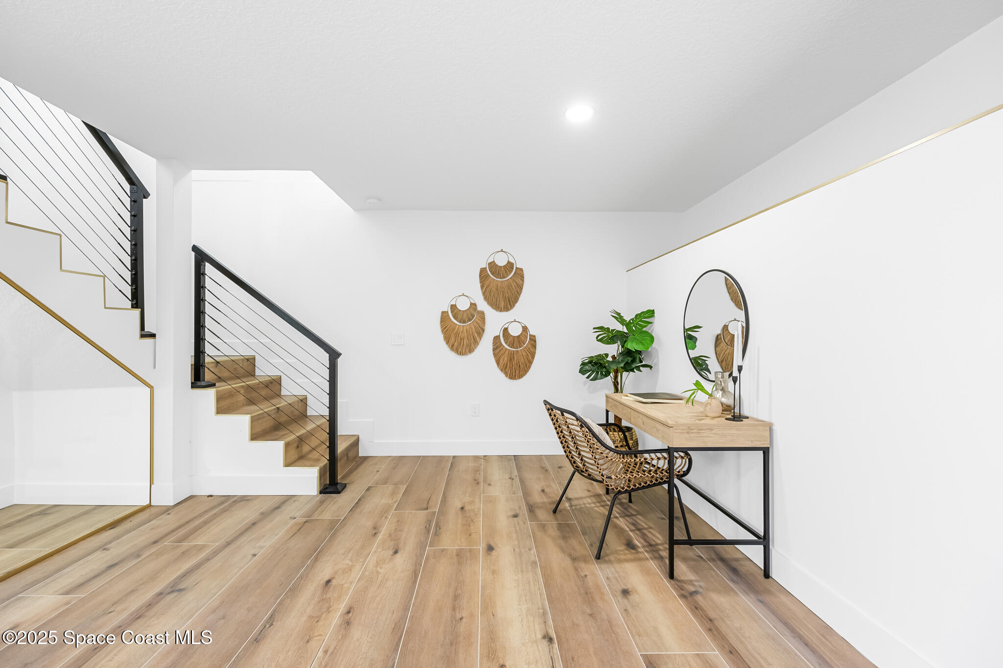 1313 Worth Court Northeast Palm Bay, FL 32905 - Photo 53 of 77 a view of a workspace room with wooden floor and windows