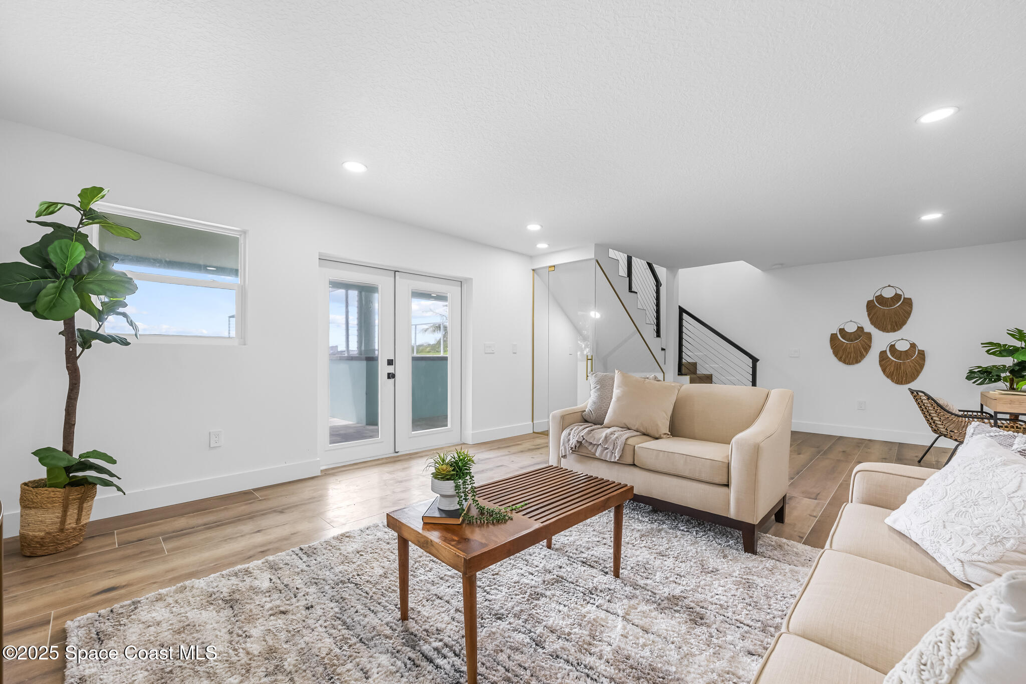 1313 Worth Court Northeast Palm Bay, FL 32905 - Photo 56 of 77 a living room with furniture and a potted plant