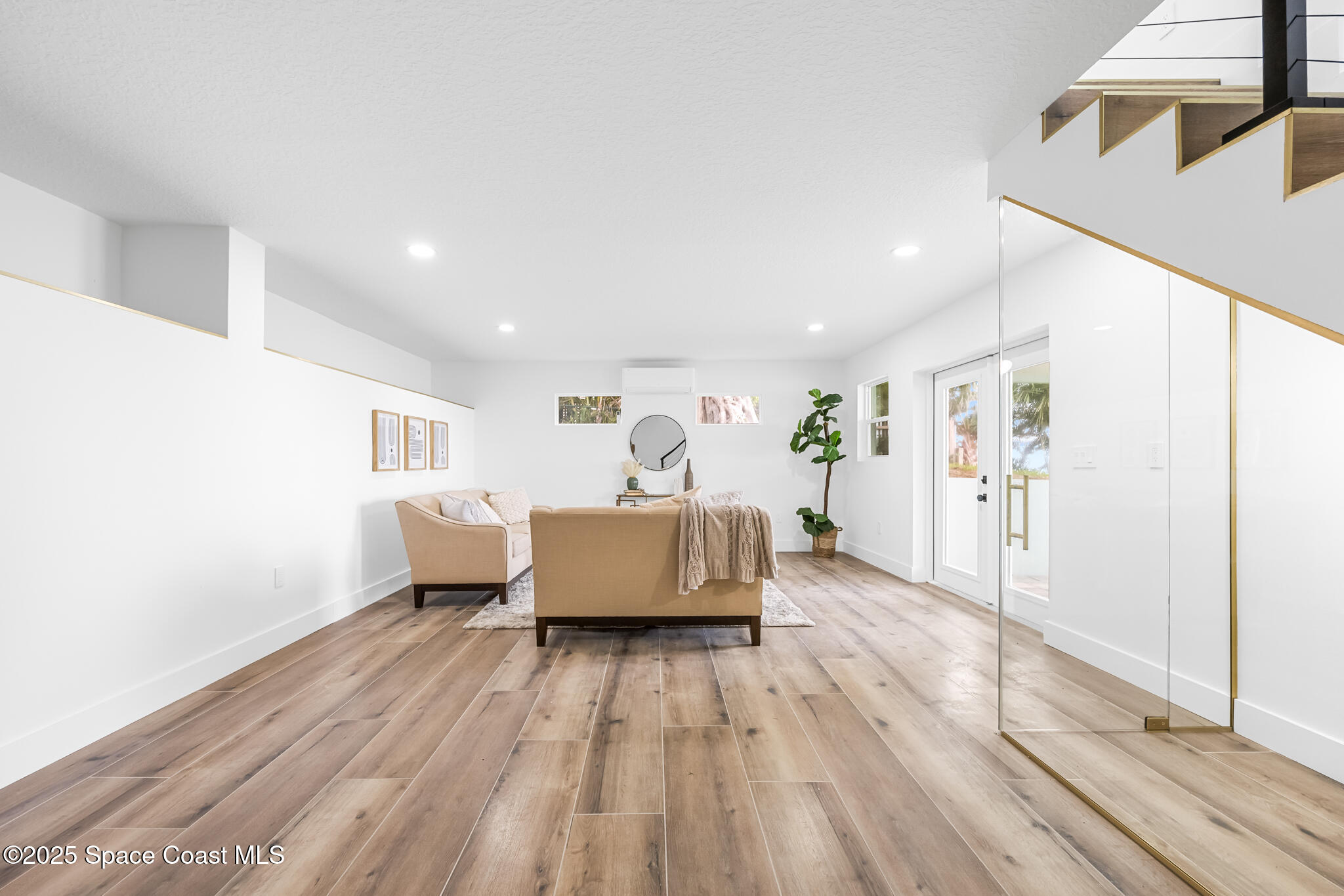 1313 Worth Court Northeast Palm Bay, FL 32905 - Photo 57 of 77 a living room with furniture and wooden floor