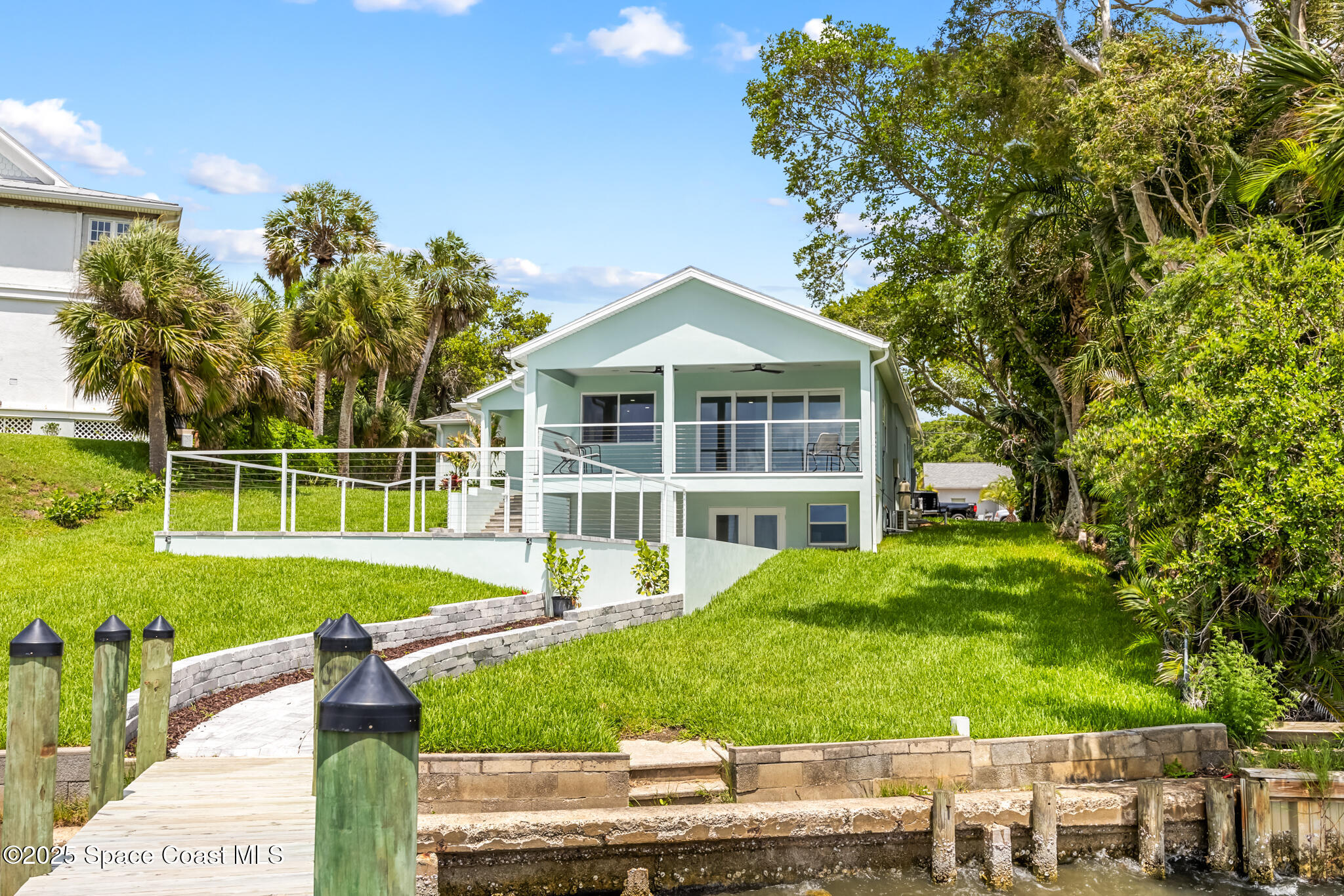 1313 Worth Court Northeast Palm Bay, FL 32905 - Photo 63 of 77 a front view of a house with a yard