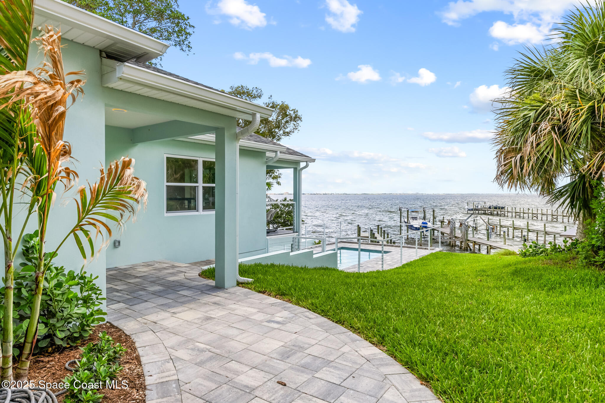 1313 Worth Court Northeast Palm Bay, FL 32905 - Photo 7 of 77 a view of a house with a yard and sitting area
