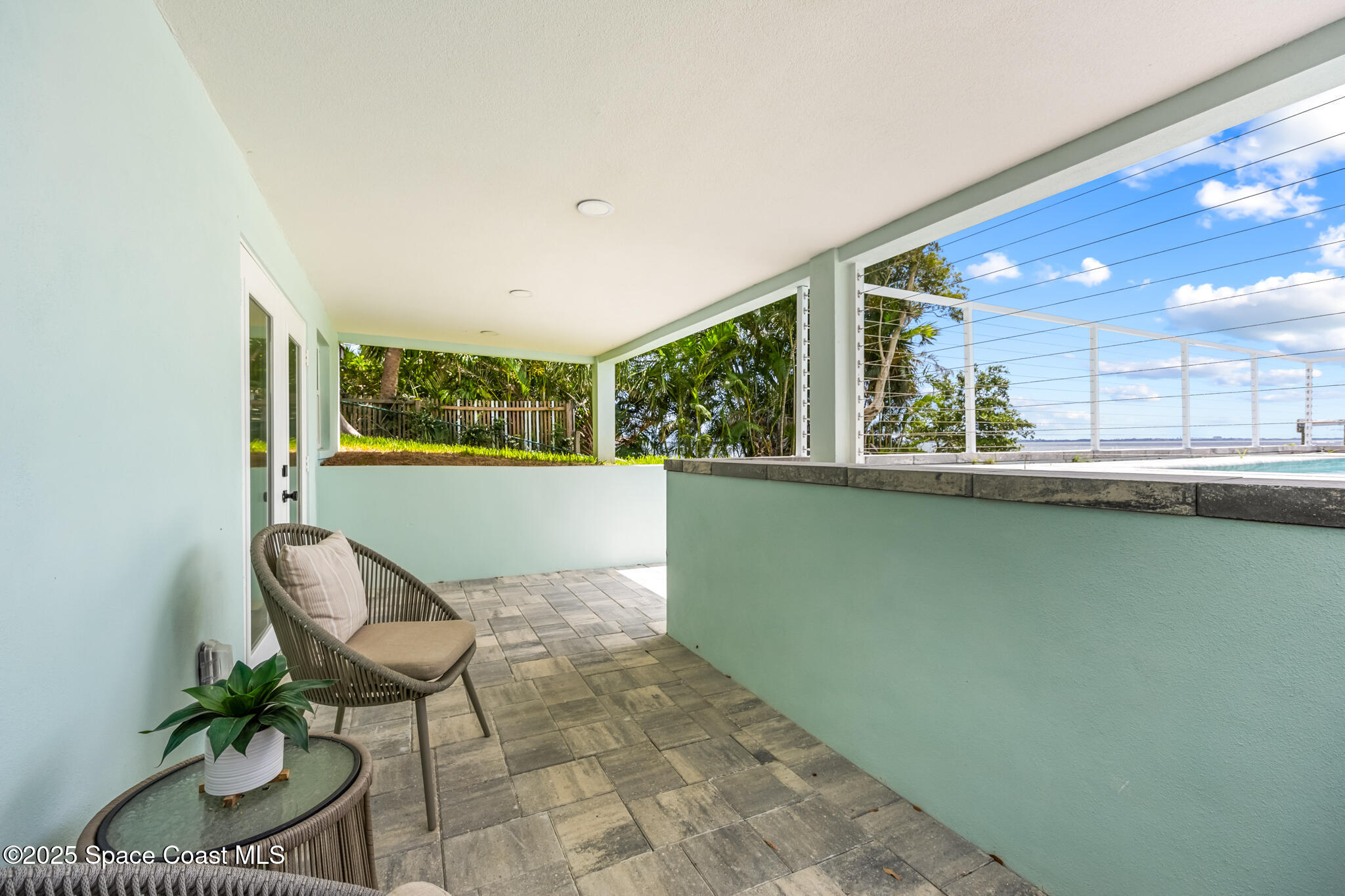 1313 Worth Court Northeast Palm Bay, FL 32905 - Photo 73 of 77 a living room with a floor to ceiling window and furniture