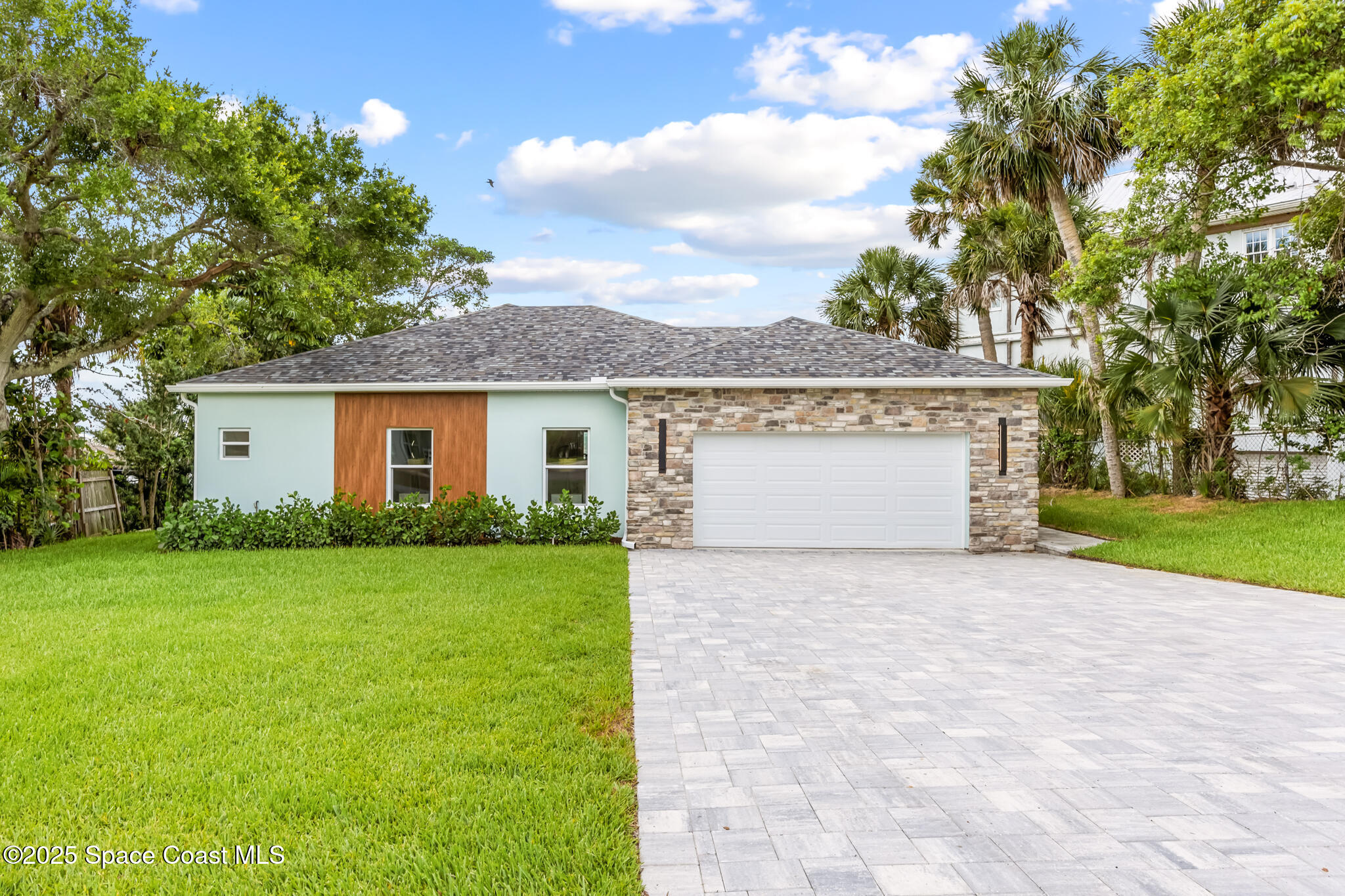 1313 Worth Court Northeast Palm Bay, FL 32905 - Photo 77 of 77 a front view of a house with garden
