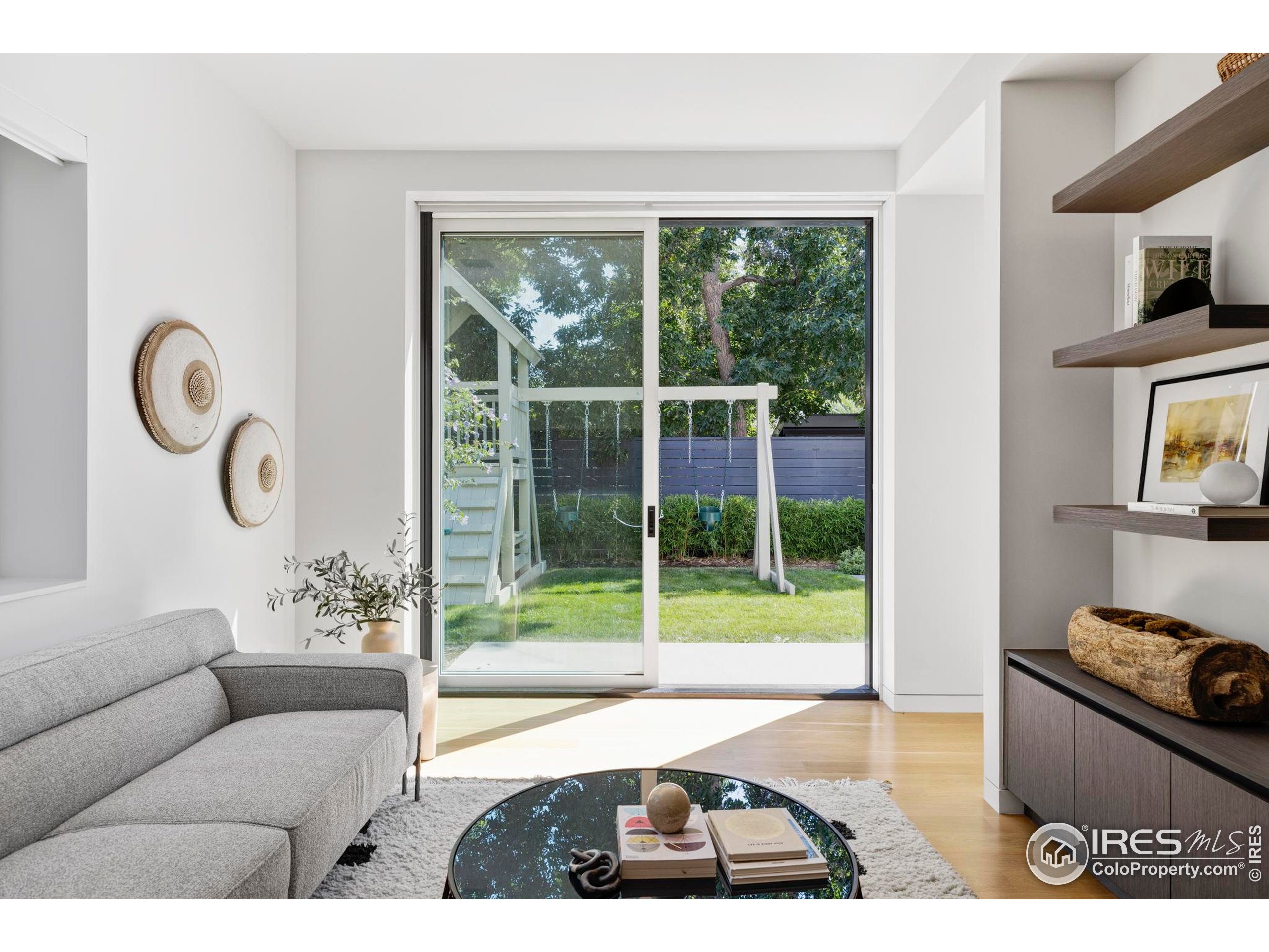 2670 6th Street Boulder, CO 80304 - Photo 11 of 30 a living room with furniture and a floor to ceiling window