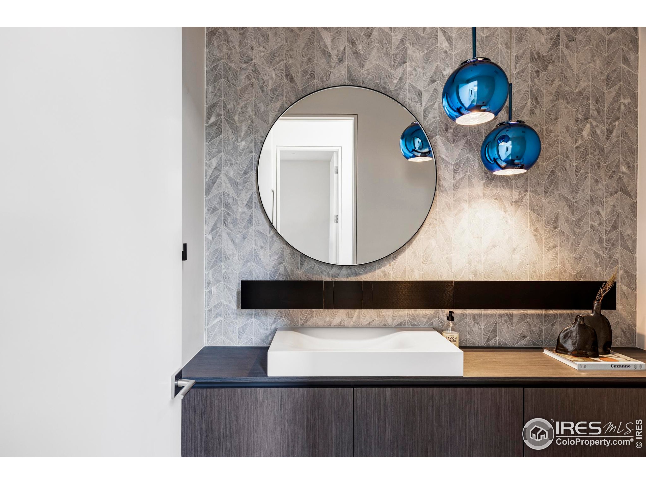 2670 6th Street Boulder, CO 80304 - Photo 13 of 30 a bathroom with a sink and a mirror