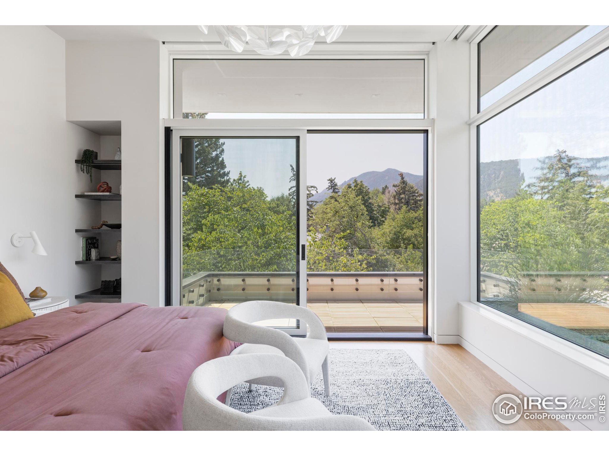 2670 6th Street Boulder, CO 80304 - Photo 15 of 30 a bedroom with a bed and glass window