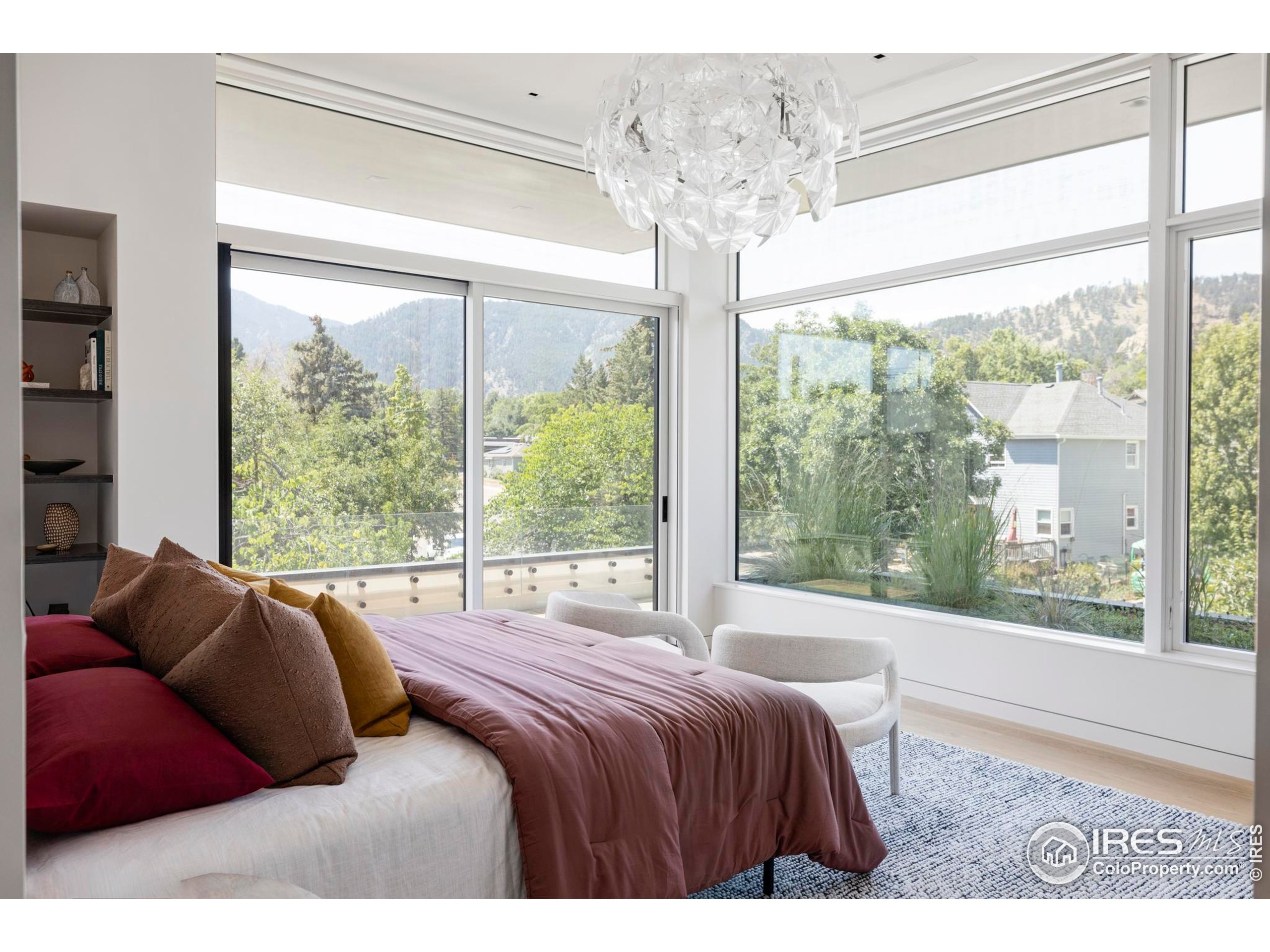 2670 6th Street Boulder, CO 80304 - Photo 16 of 30 a bed sitting in a bedroom next to a large window