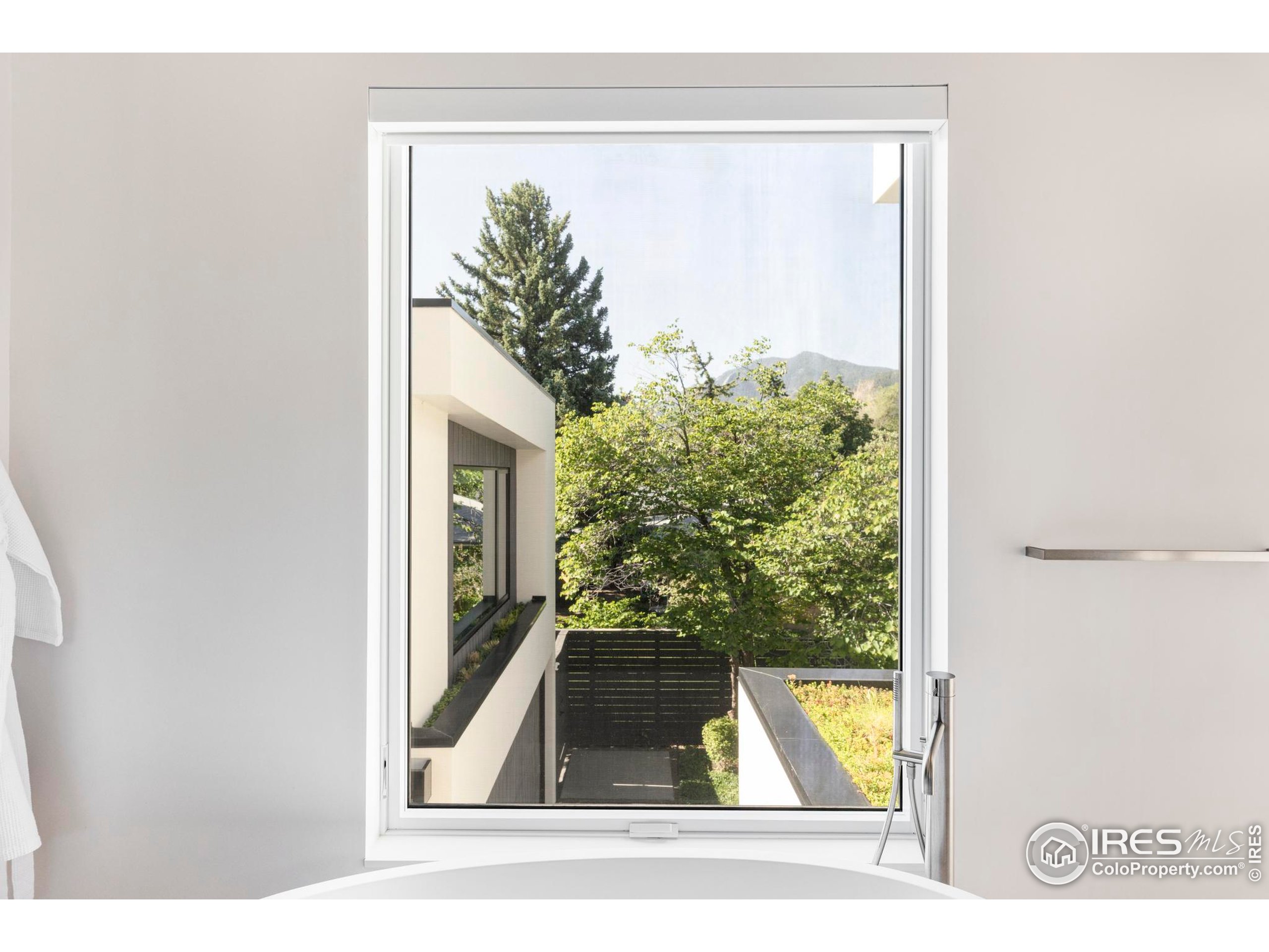 2670 6th Street Boulder, CO 80304 - Photo 19 of 30 a picture of a small yard with a large window