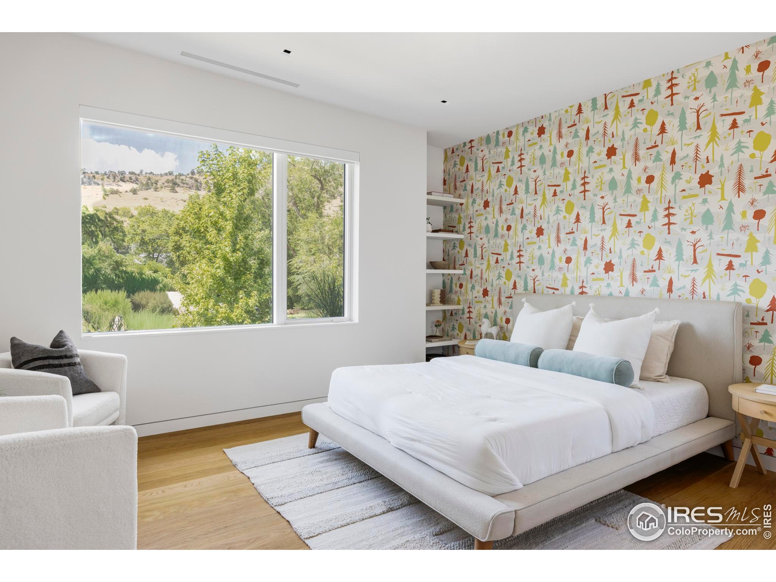 2670 6th Street Boulder, CO 80304 - Photo 20 of 30 a bedroom with a large bed and a large window
