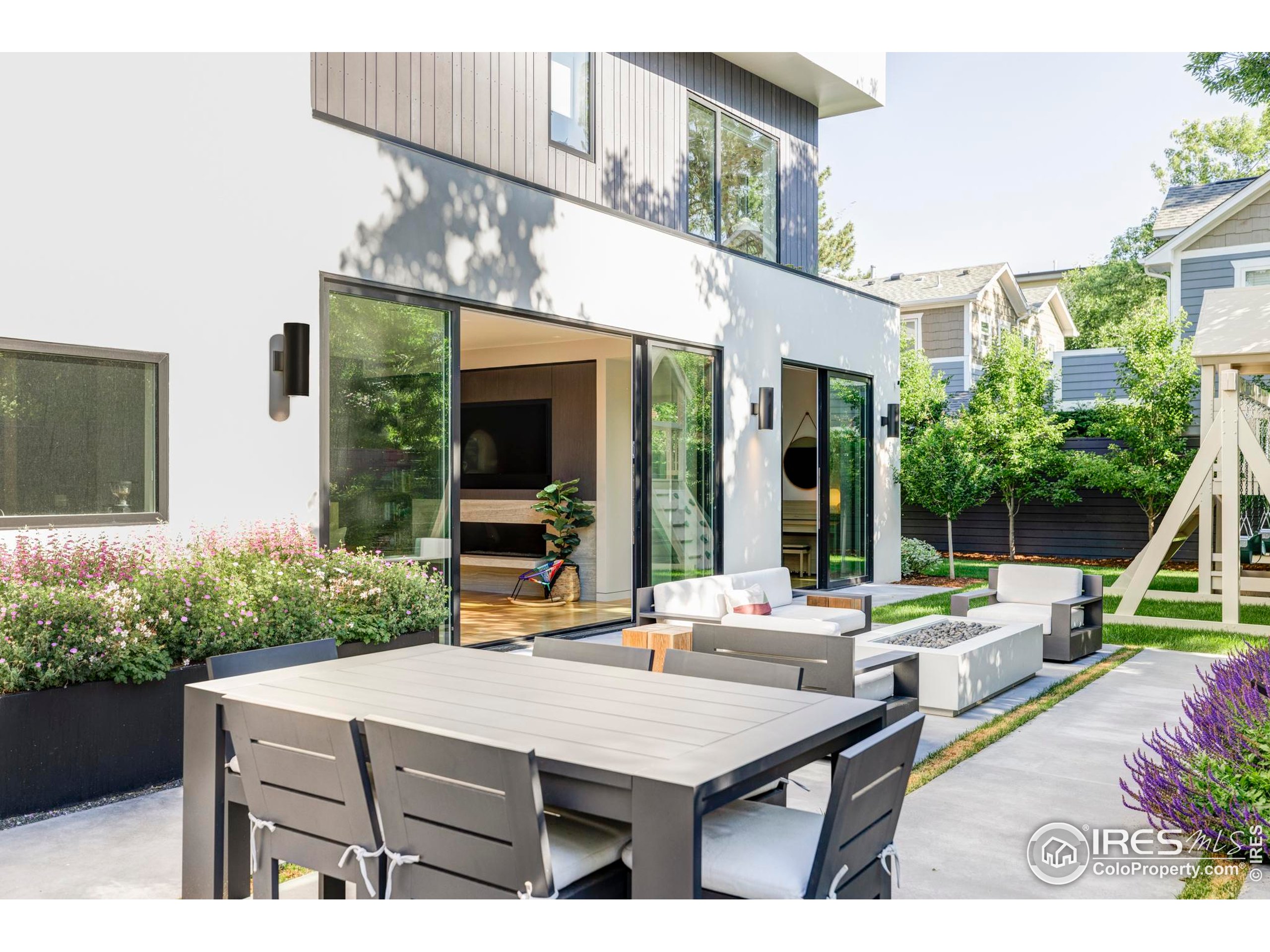 2670 6th Street Boulder, CO 80304 - Photo 25 of 30 a view of a patio with table and chairs potted plants with wooden floor