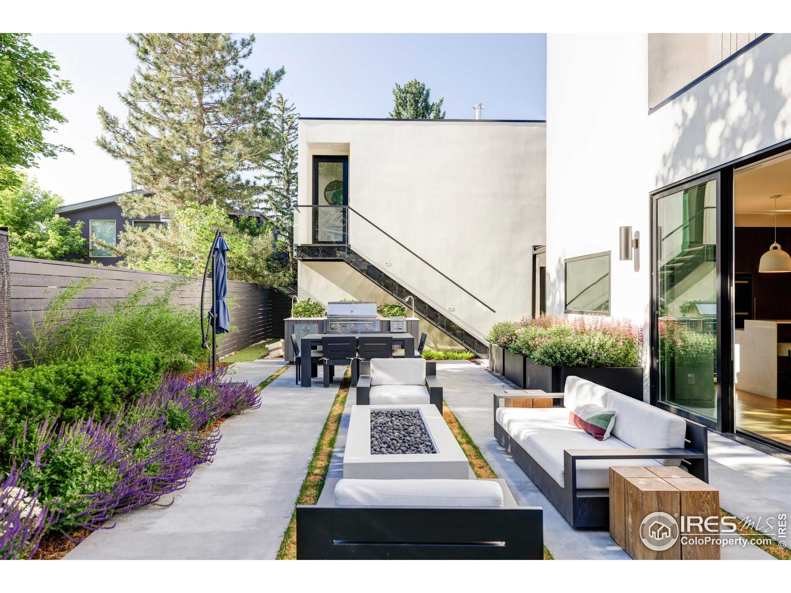 2670 6th Street Boulder, CO 80304 - Photo 6 of 30 a view of a patio with table and chairs and potted plants