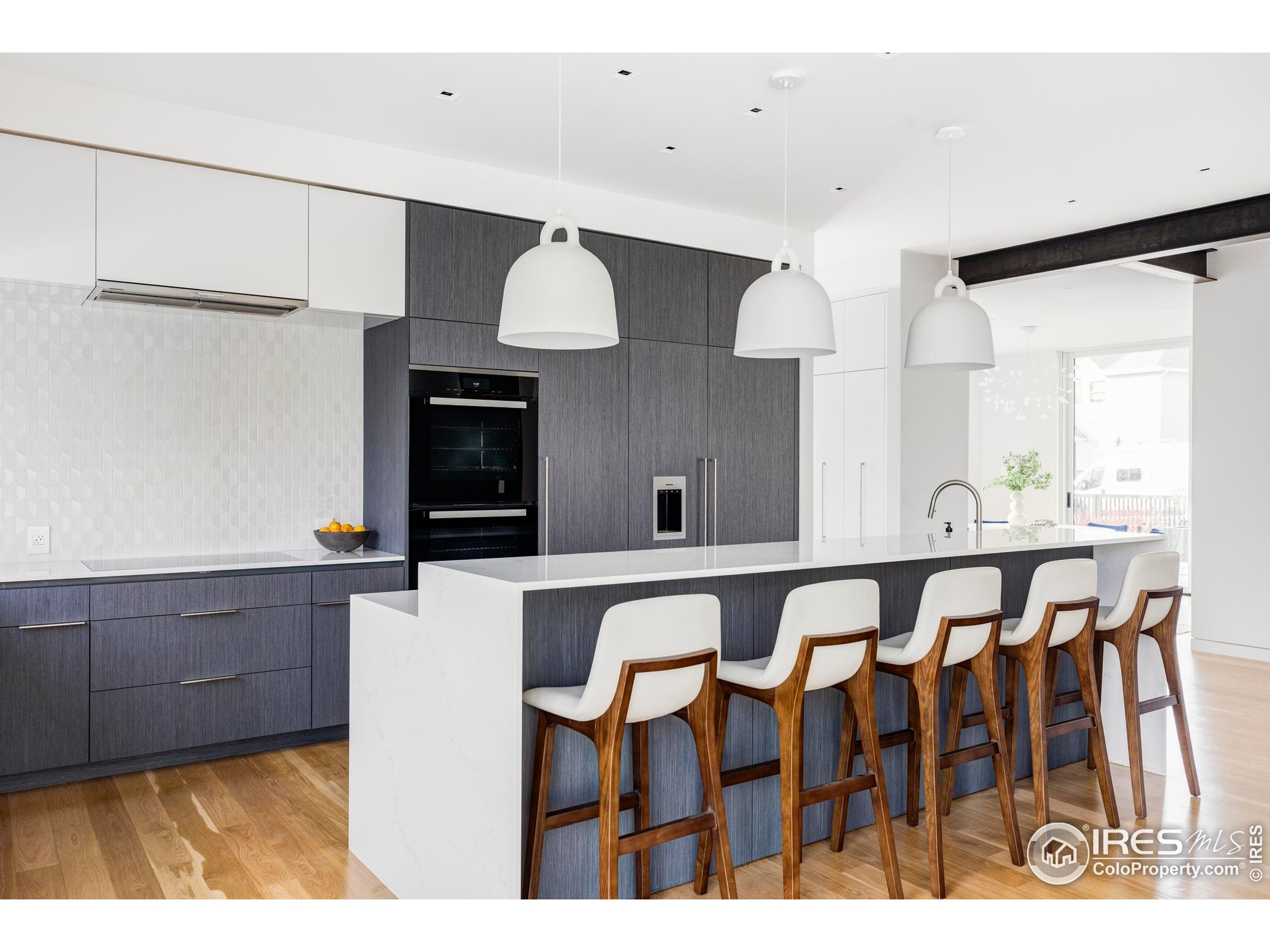 2670 6th Street Boulder, CO 80304 - Photo 7 of 30 a view of kitchen with cabinets and wooden floor