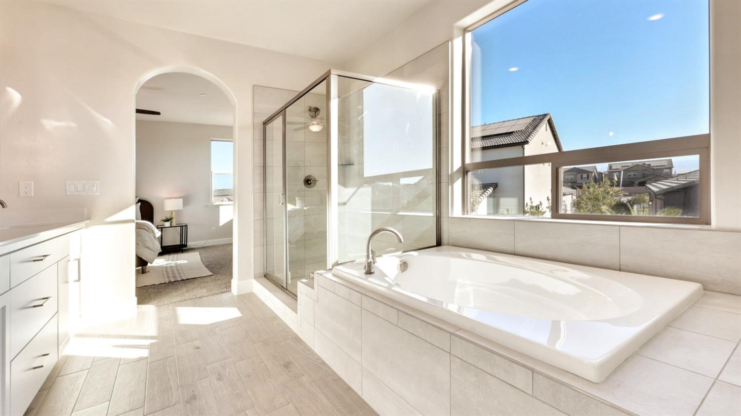 951 Talus Way South Madera, CA 93636 - Photo 20 of 36 a spacious bathroom with a tub sink and mirror