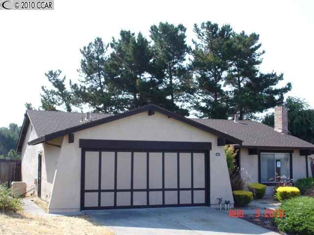 944 Beachpoint Way Rodeo, CA 94572 - Photo 1 of 1 a front view of a house with garden