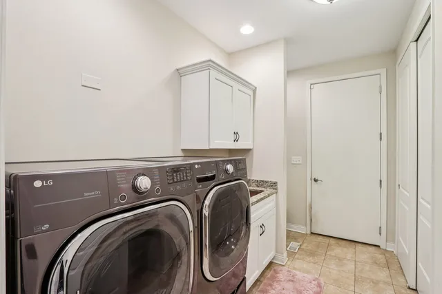 a view of storage and utility room with washer and dryer