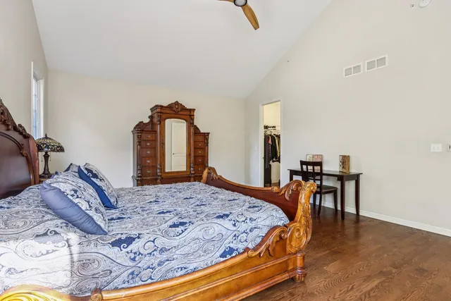a bedroom with a bed and dresser