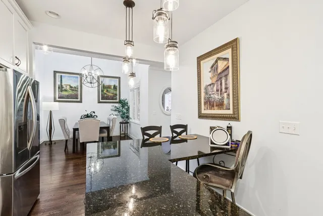 a living room with fireplace furniture and a chandelier