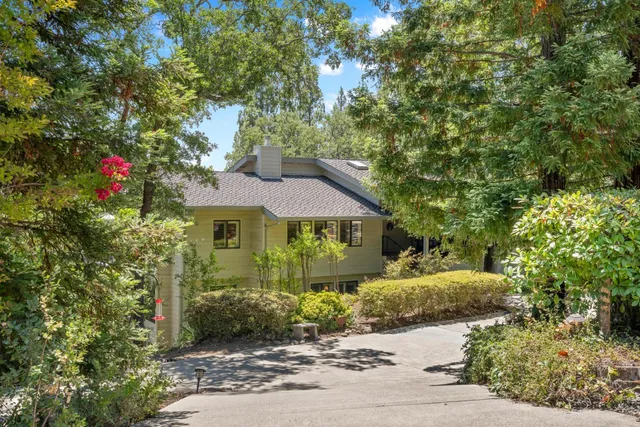 a view of a house with a tree