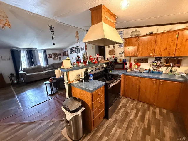 a kitchen with stainless steel appliances granite countertop a stove and a refrigerator