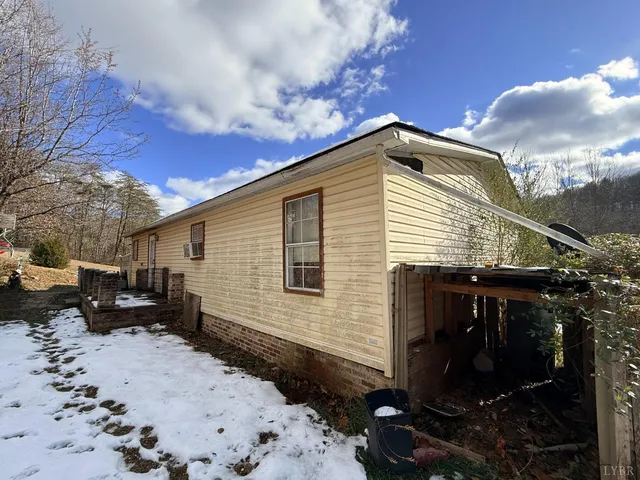 a view of house with yard outdoor seating and barbeque oven