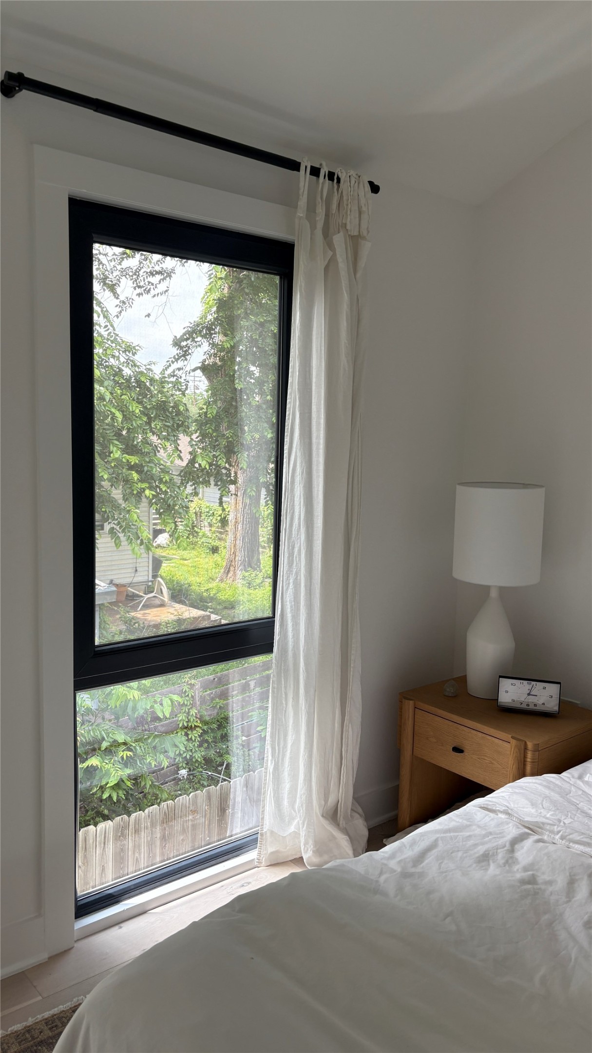 1816 Adina Street, Unit 2 Austin, TX 78721 - Photo 13 of 25 Full-height window with a black frame and white trim