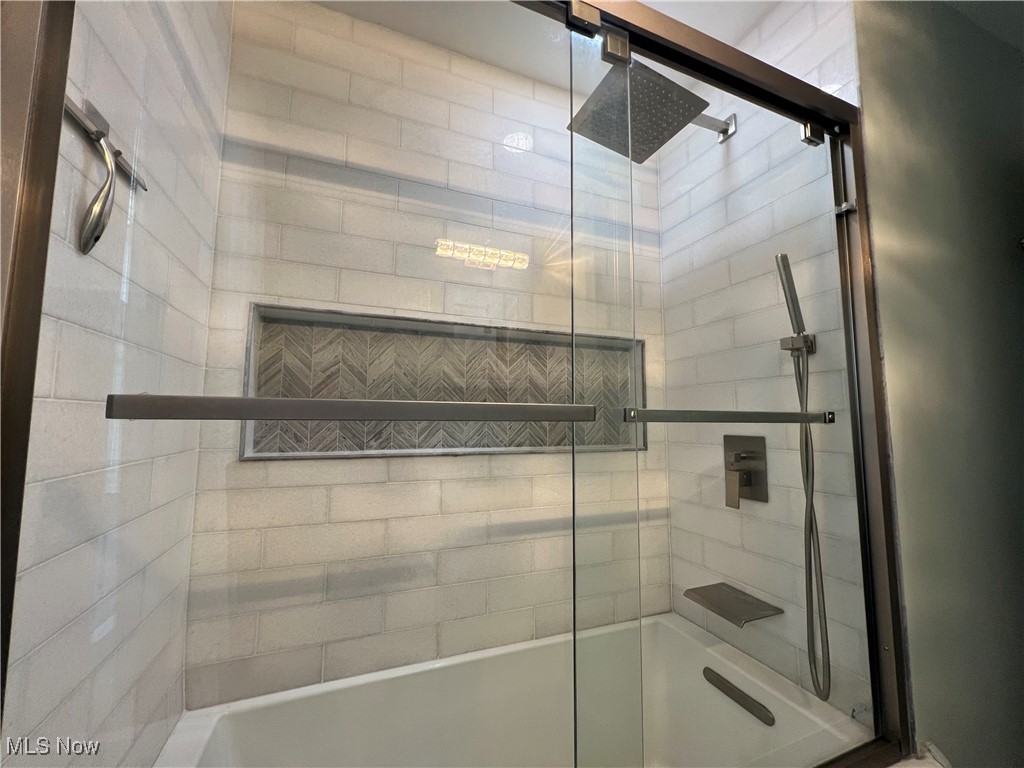 20611 Franklin Road Maple Heights, OH 44137 - Photo 15 of 31 Bathroom featuring combined bath / shower with glass door
