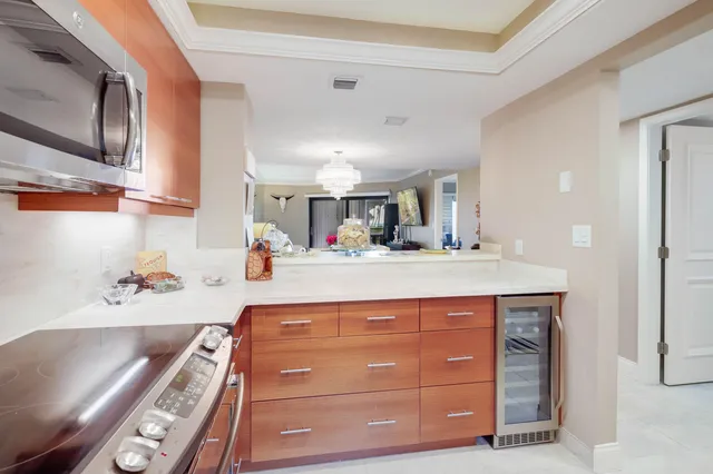 a kitchen with refrigerator and cabinets