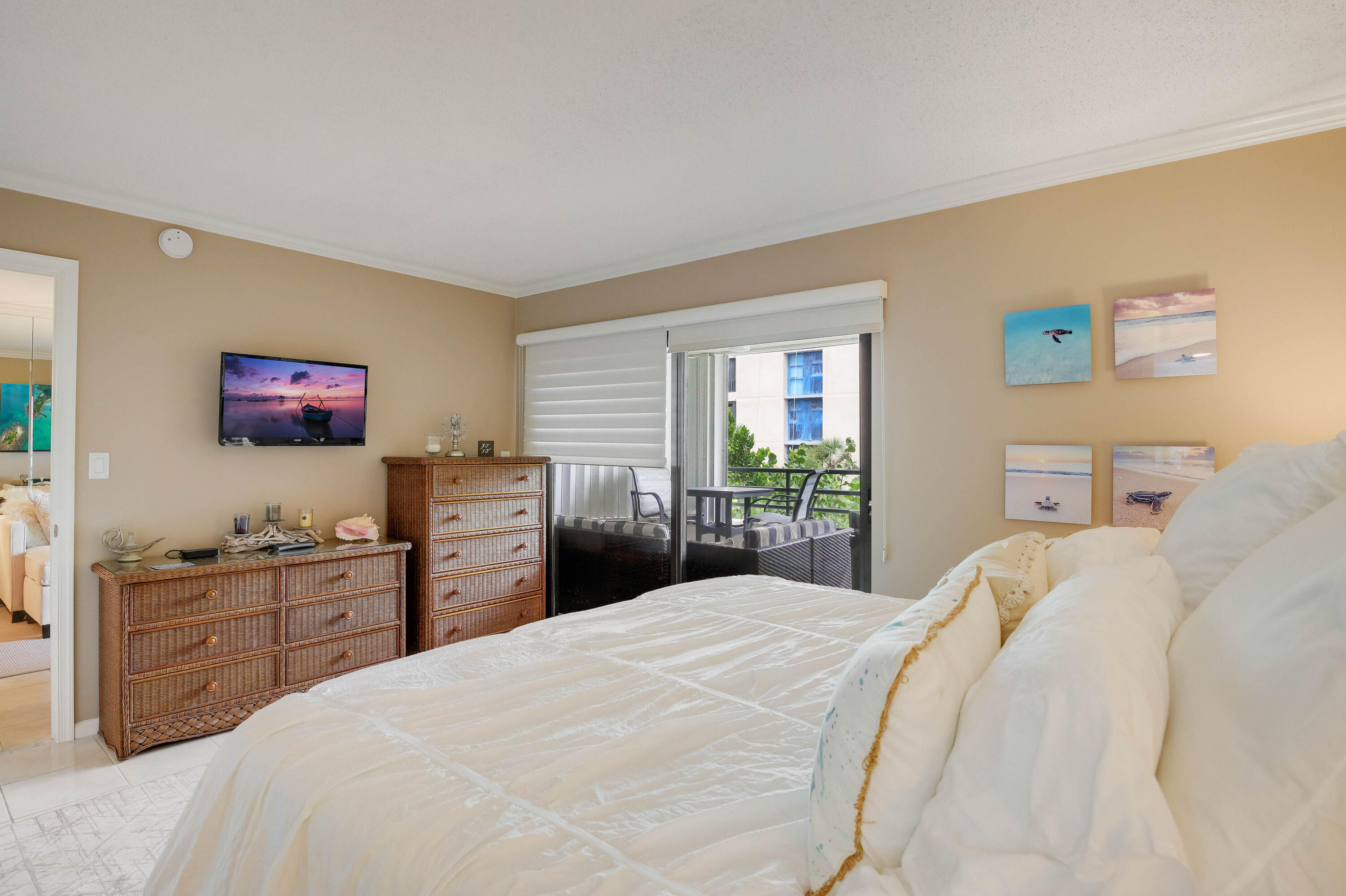 420 Celestial Way, Unit 204 Juno Beach, FL 33408 - Photo 18 of 35 a bedroom with a bed and a dresser