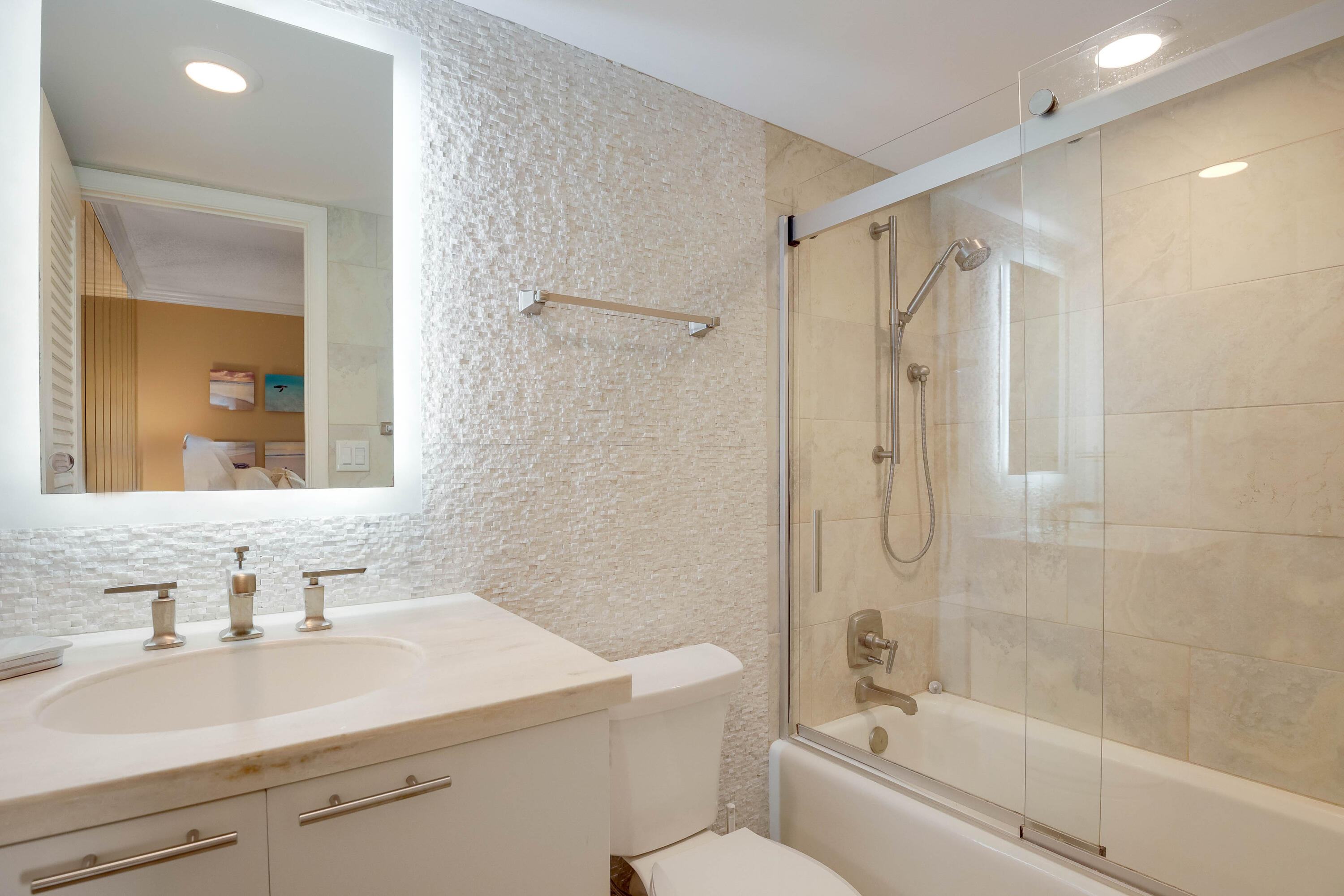 420 Celestial Way, Unit 204 Juno Beach, FL 33408 - Photo 19 of 35 a bathroom with a sink a toilet and shower