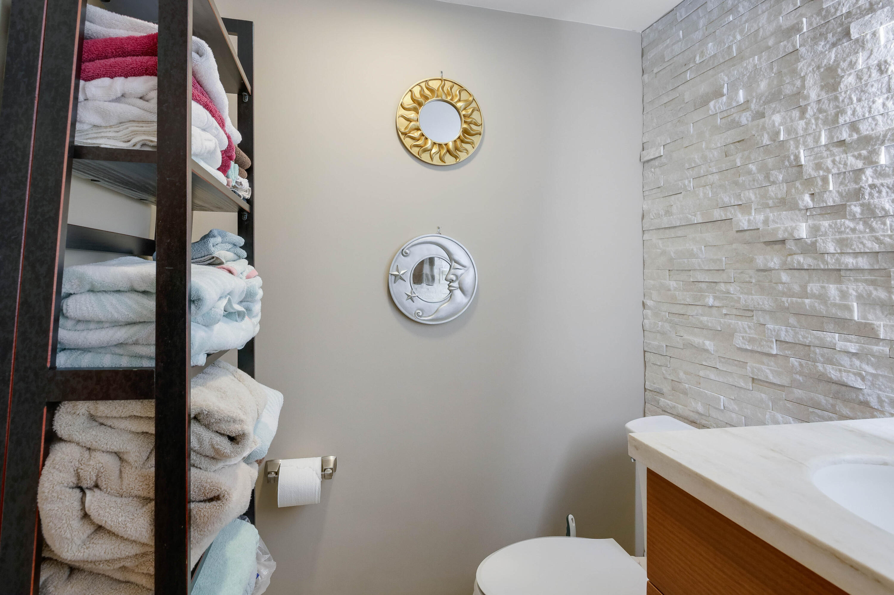 420 Celestial Way, Unit 204 Juno Beach, FL 33408 - Photo 21 of 35 a bathroom with a toilet and a sink