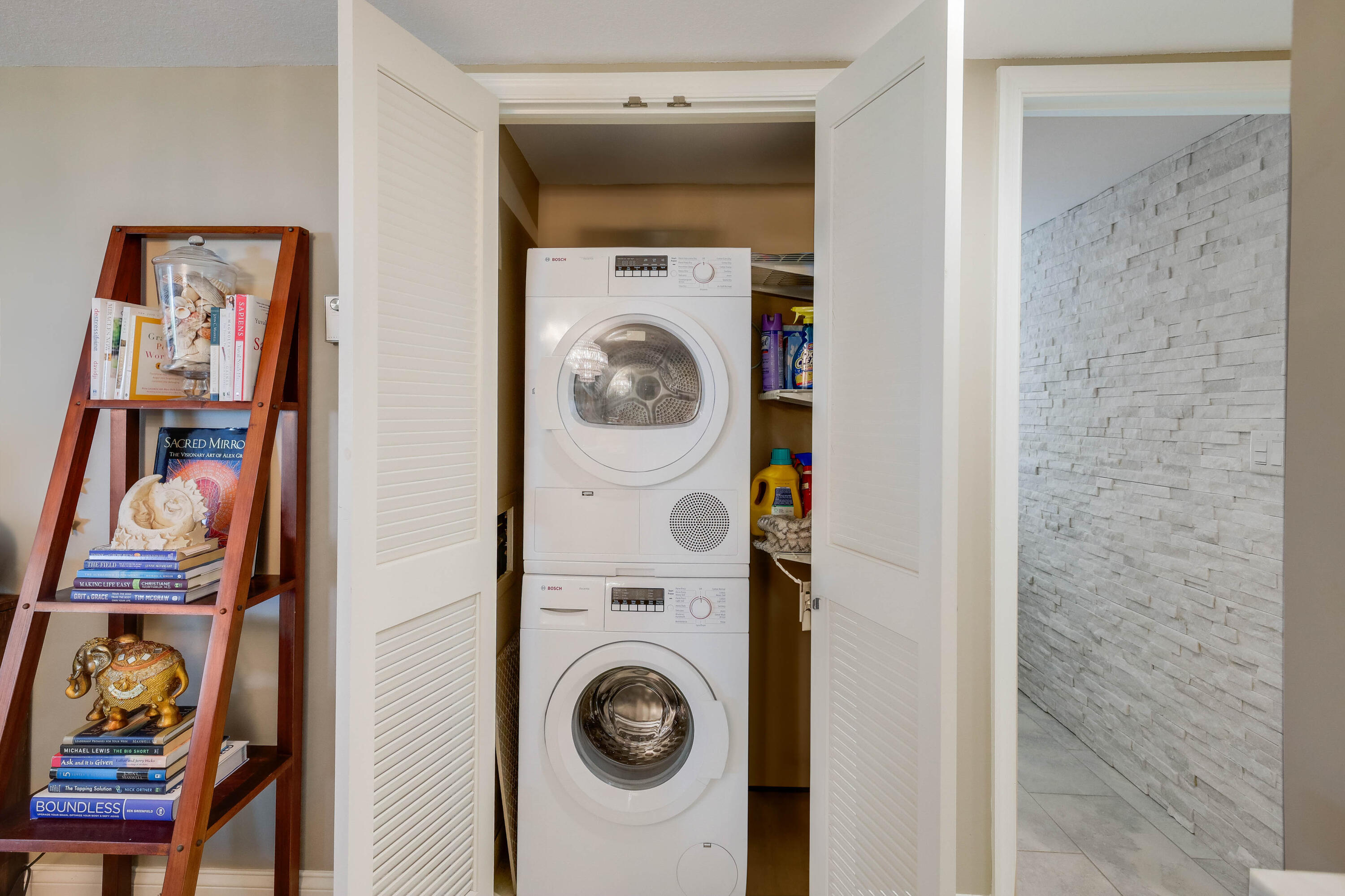 420 Celestial Way, Unit 204 Juno Beach, FL 33408 - Photo 22 of 35 a utility room with dryer and washer